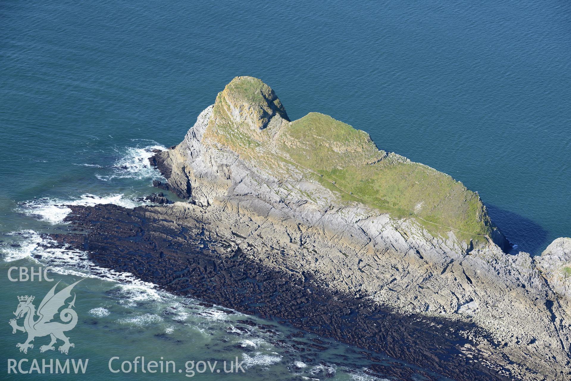 Worms Head, on the western coast of the Gower Peninsula. Oblique aerial photograph taken during the Royal Commission's programme of archaeological aerial reconnaissance by Toby Driver on 30th September 2015.