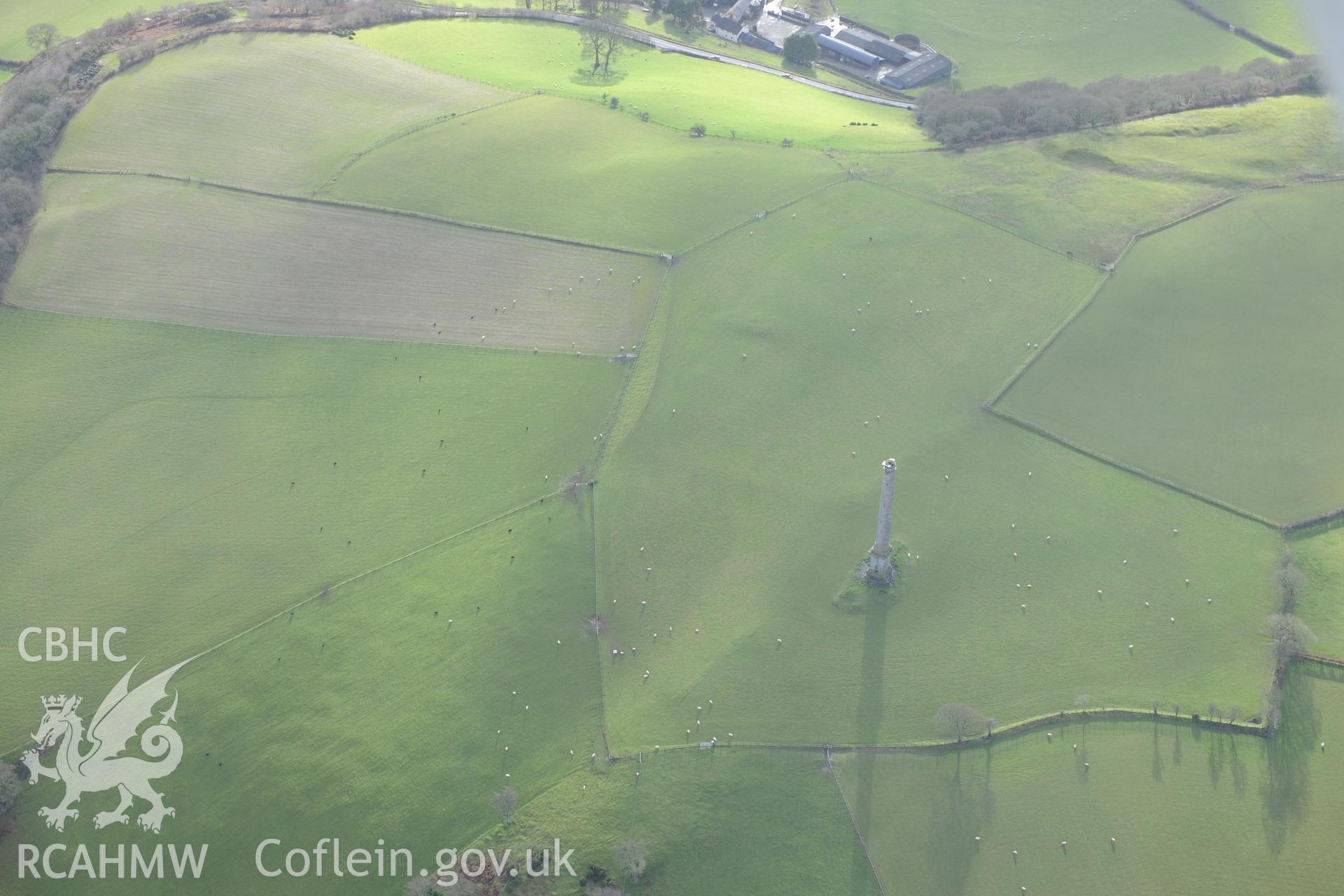 Derry-Ormond Tower with Coed-Park Gaer Hillfort in background. Oblique aerial photograph taken during the Royal Commission's programme of archaeological aerial reconnaissance by Toby Driver on 6th January 2015.