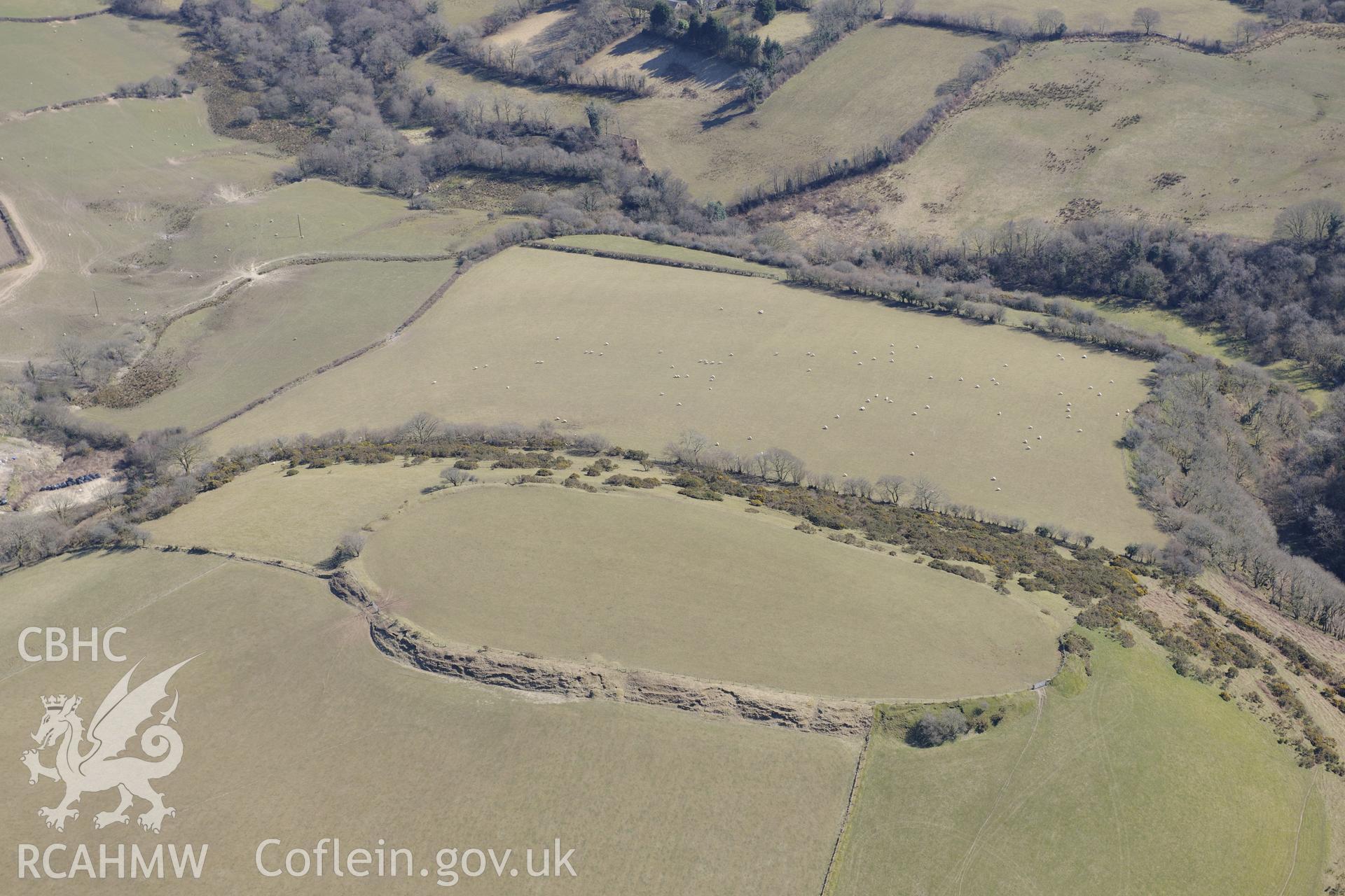 Castell Moeddyn defended enclosure or hillfort north of Gorsgoch, near Lampeter. Oblique aerial photograph taken during the Royal Commission's programme of archaeological aerial reconnaissance by Toby Driver on 2nd April 2013.