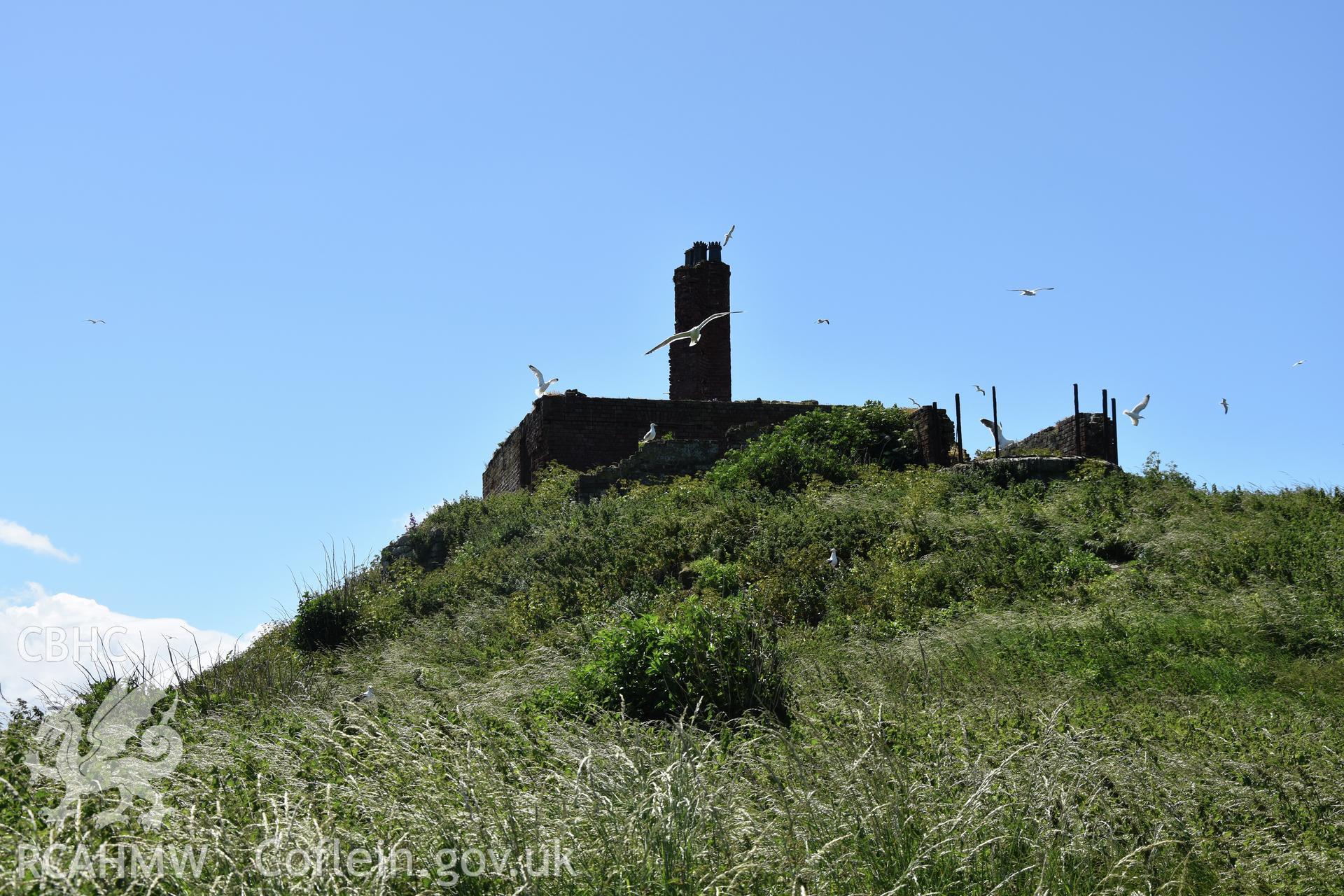 Investigator's photographic survey of the Telegraph Station on Puffin Island or Ynys Seiriol for the CHERISH Project. Exterior view of roofless building. ? Crown: CHERISH PROJECT 2018. Produced with EU funds through the Ireland Wales Co-operation Programme 2014-2020. All material made freely available through the Open Government Licence.