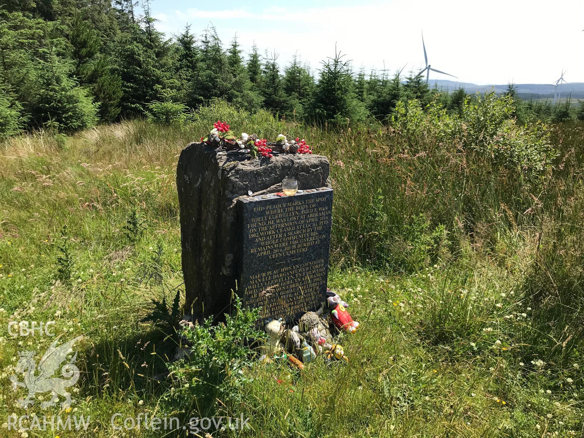 Digital colour photograph of a modern memorial stone dedicated to Willy Llewellyn at Carn Foeser, Glyncorrwg, taken by Paul R. Davis on 23rd July 2019.