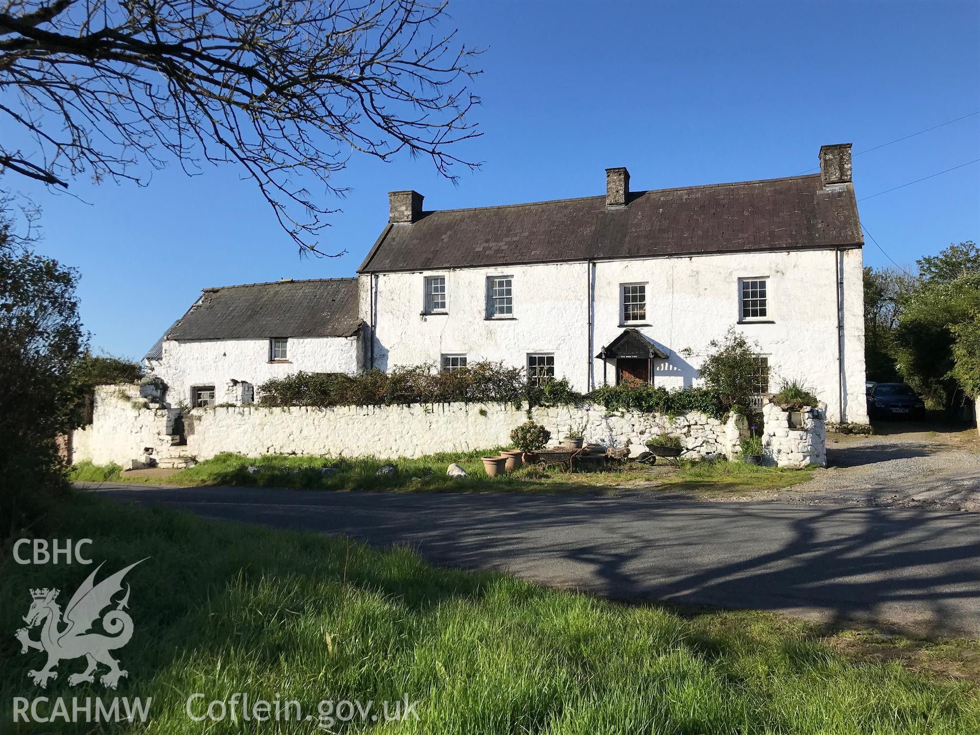 Digital colour photograph showing exterior view of the front elevation of Tyle House Farm, Burry Green, Swansea, taken by Paul R. Davis on 5th May 2019.