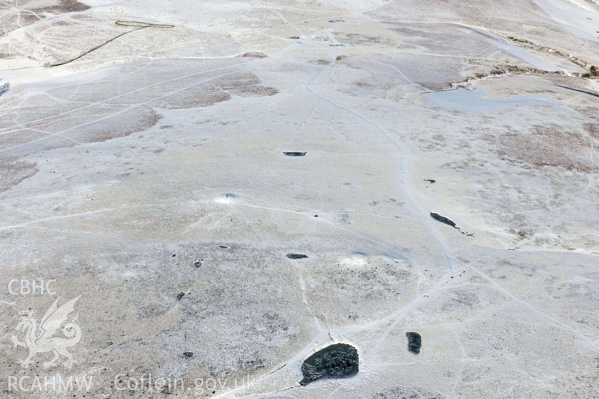 Barrow V and VI on Aberedw Hill, east of Builth Wells. Oblique aerial photograph taken during the Royal Commission?s programme of archaeological aerial reconnaissance by Toby Driver on 15th January 2013.