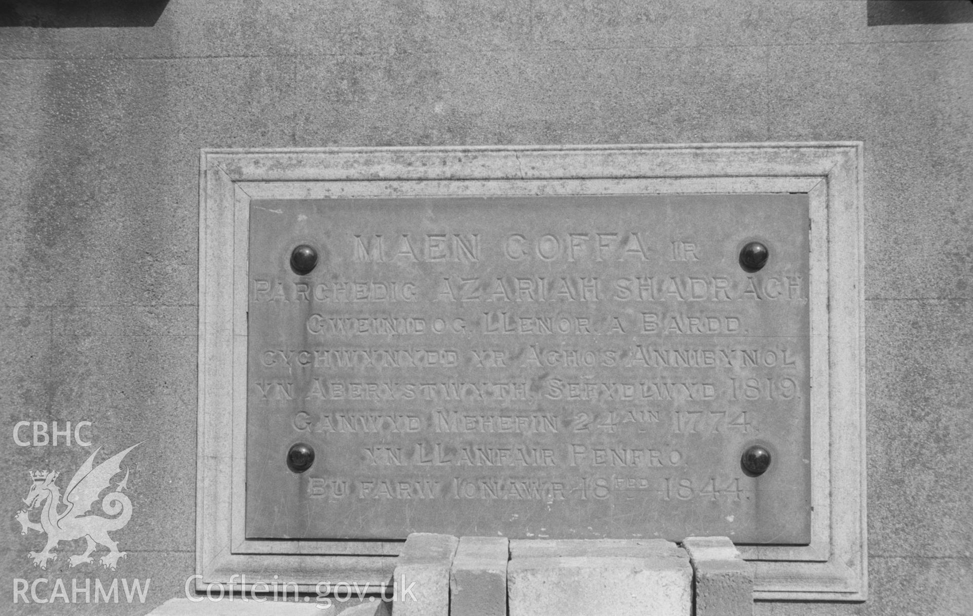 Digital copy of a black and white negative showing memorial-stone (to the Rev. Azariah Shadrach, who established the Independent cause at Aberystwyth in 1819) at Vulcan Street Independent Chapel, Aberystwyth. Photographed in March 1964 by Arthur O. Chater.