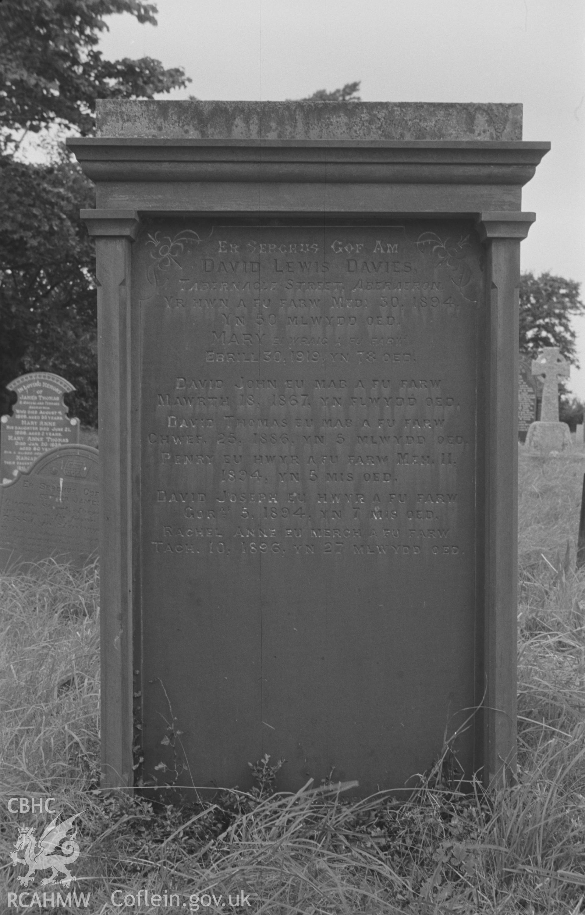 Digital copy of a black and white negative showing gravestone in memory of the Davies family at St. David's Church, Henfynyw, Aberaeron. Photographed by Arthur O. Chater on 5th September 1966 from Grid Reference SN 447 613.