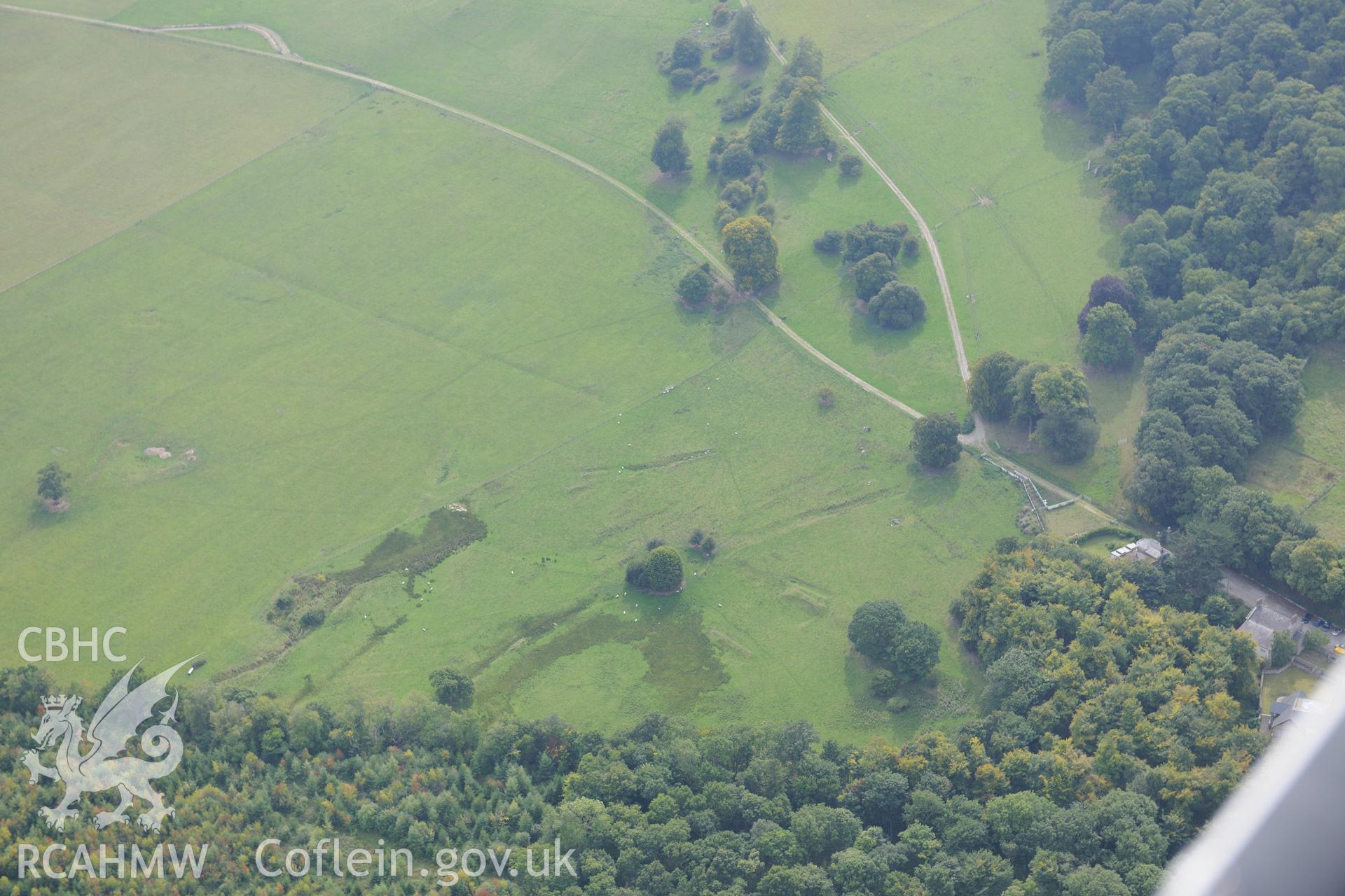 St. George's well and First World War practise trenches at Kinmel Park. Oblique aerial photograph taken during the Royal Commission's programme of archaeological aerial reconnaissance by Toby Driver on 11th September 2015.