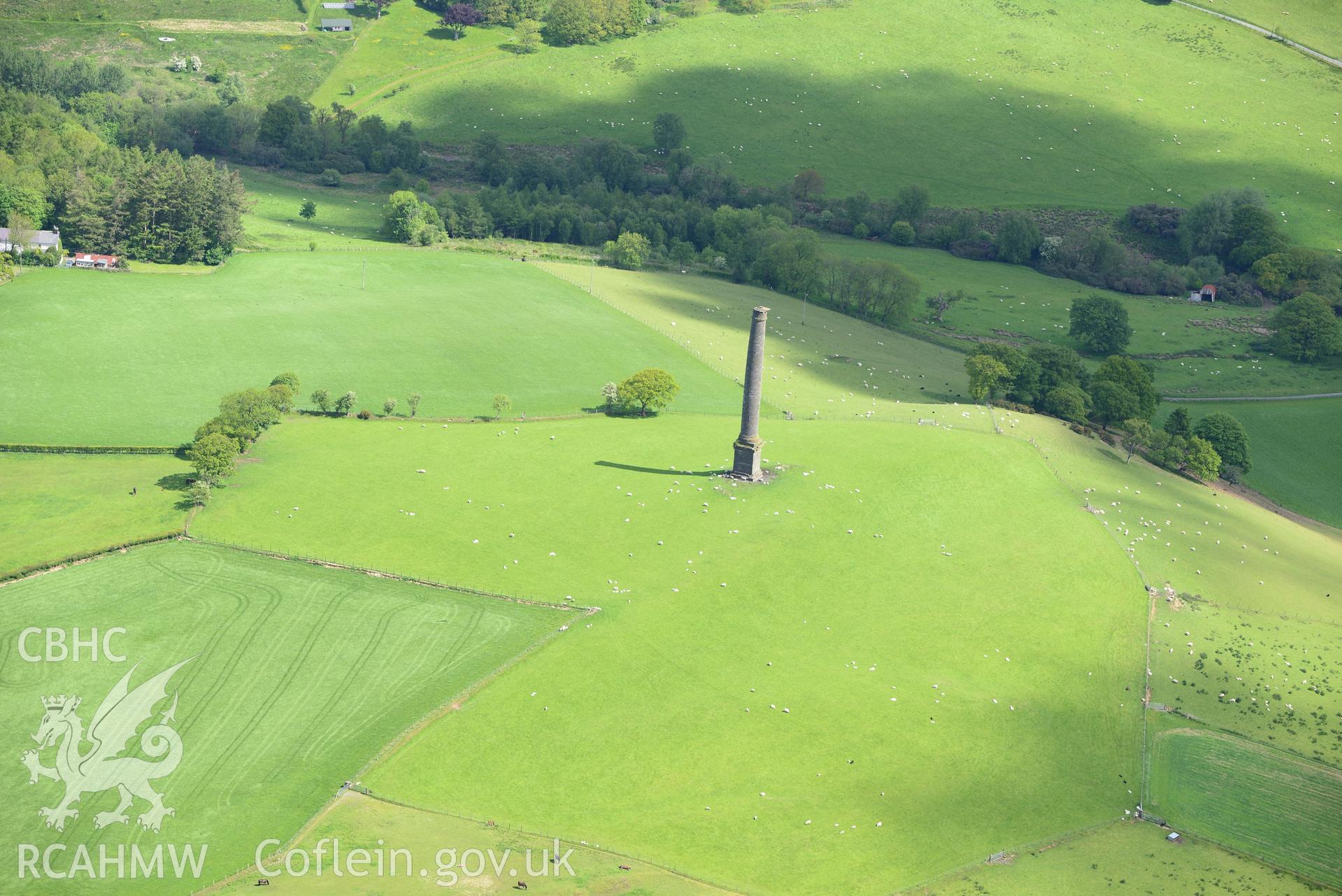 Coed-Parc hillfort and Dery-Ormond Tower. Oblique aerial photograph taken during the Royal Commission's programme of archaeological aerial reconnaissance by Toby Driver on 3rd June 2015.