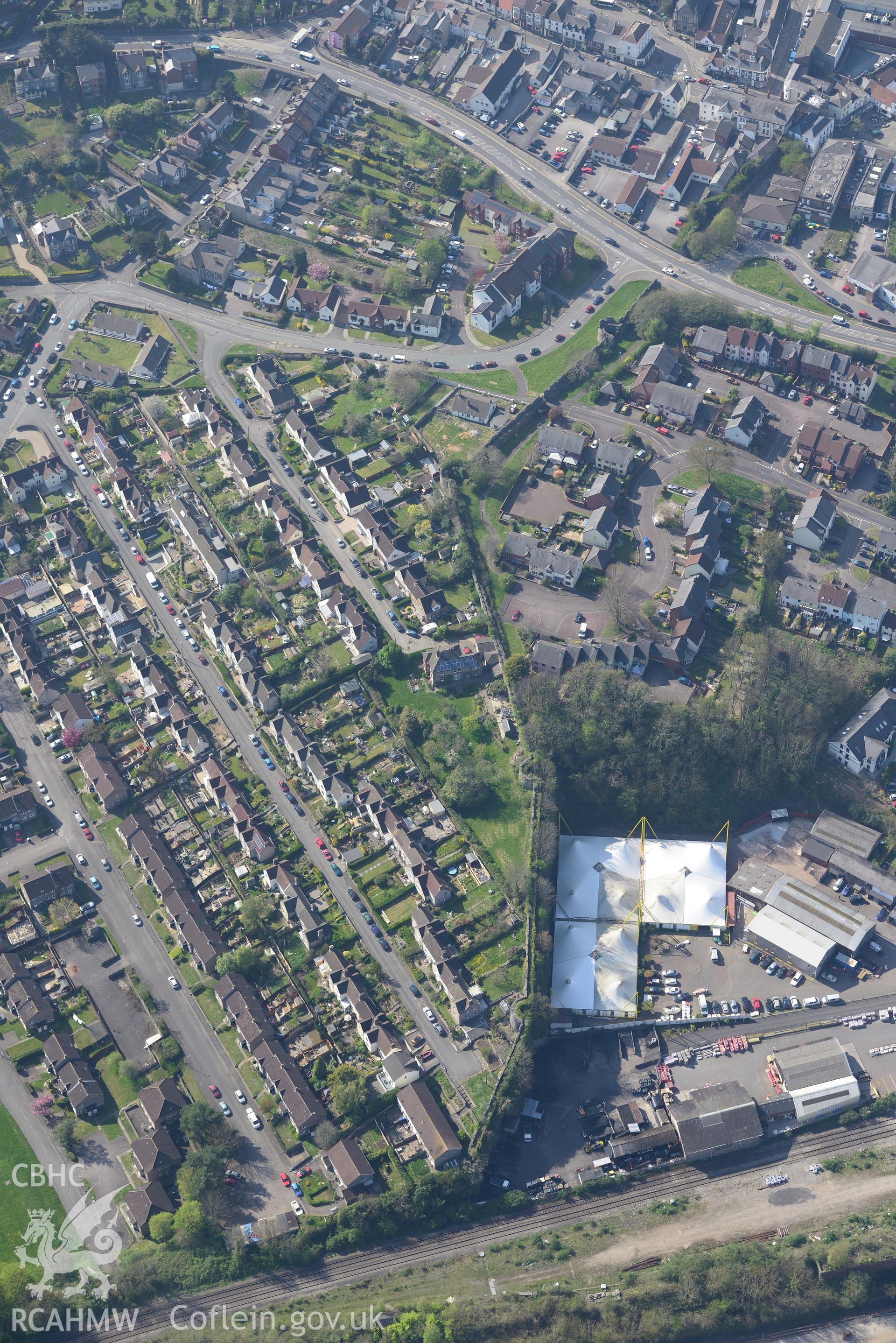 Chepstow including view of town wall and Port Wall School. Oblique aerial photograph taken during the Royal Commission's programme of archaeological aerial reconnaissance by Toby Driver on 21st April 2015.