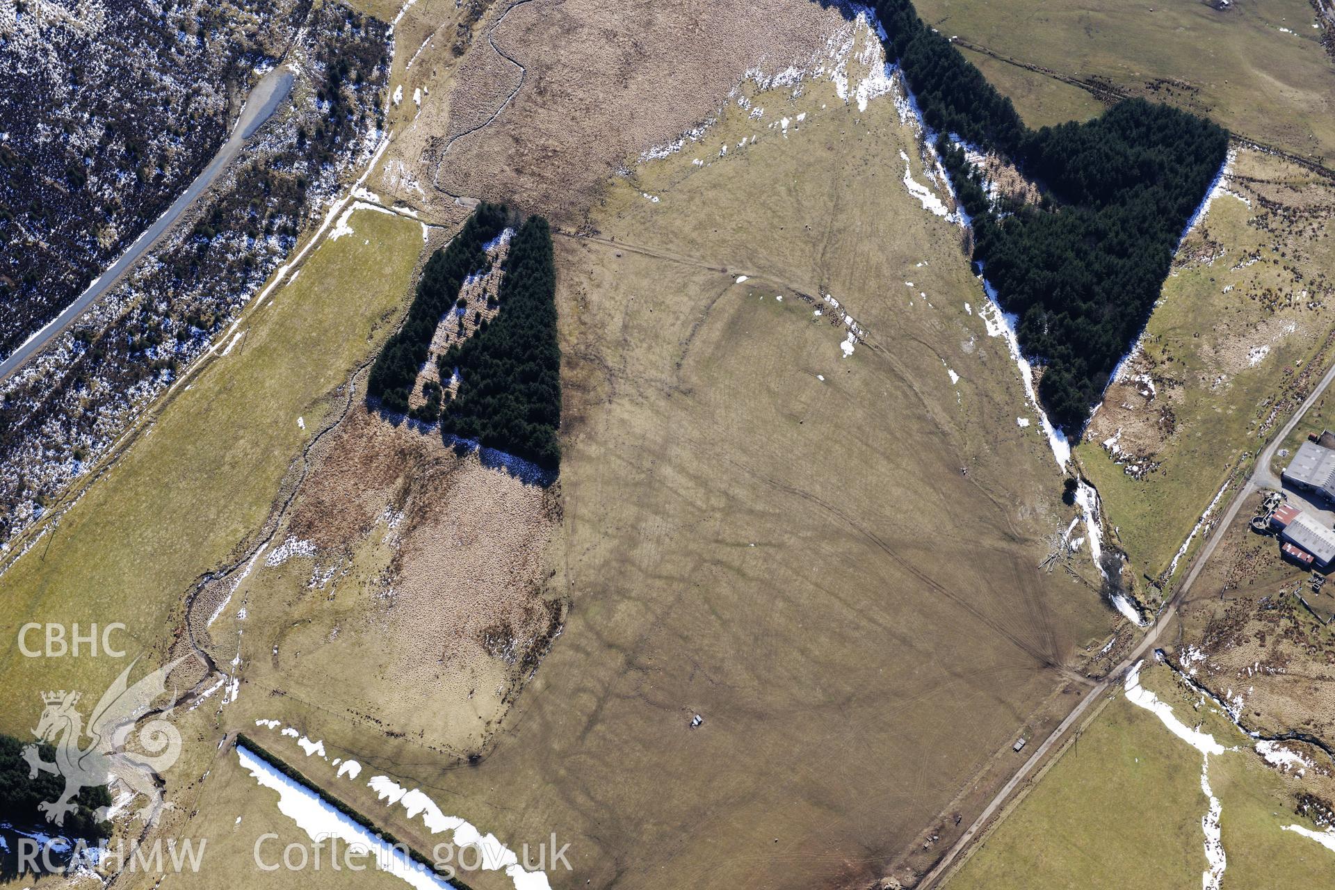 Llys Arthur defended enclosure, north east of Ponterwyd. Oblique aerial photograph taken during the Royal Commission's programme of archaeological aerial reconnaissance by Toby Driver on 2nd April 2013.