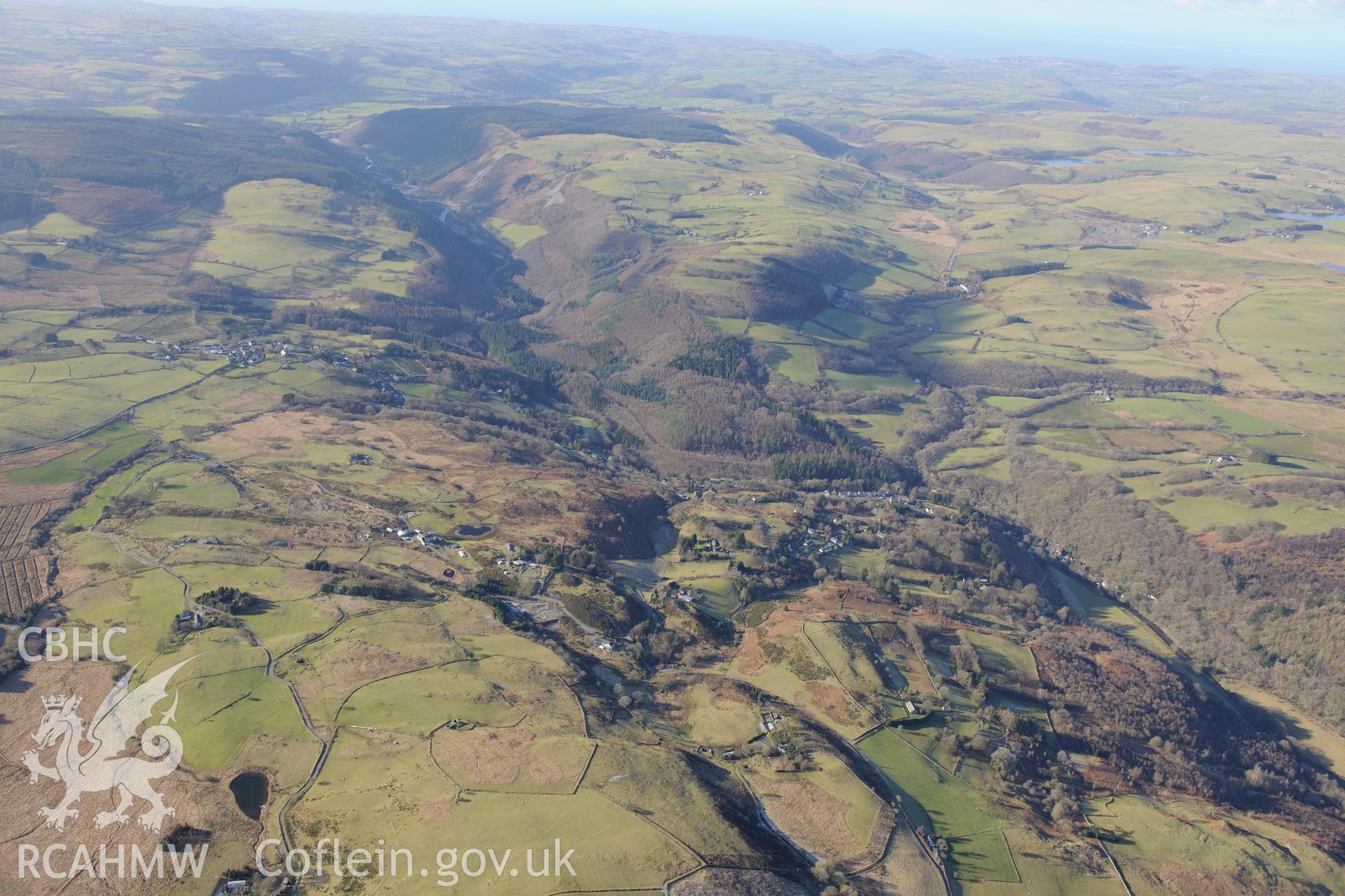 Site of former Logaulas lead mine and the village of Pontrhydygroes beyond. Oblique aerial photograph taken during the Royal Commission's programme of archaeological aerial reconnaissance by Toby Driver on 4th February 2015.