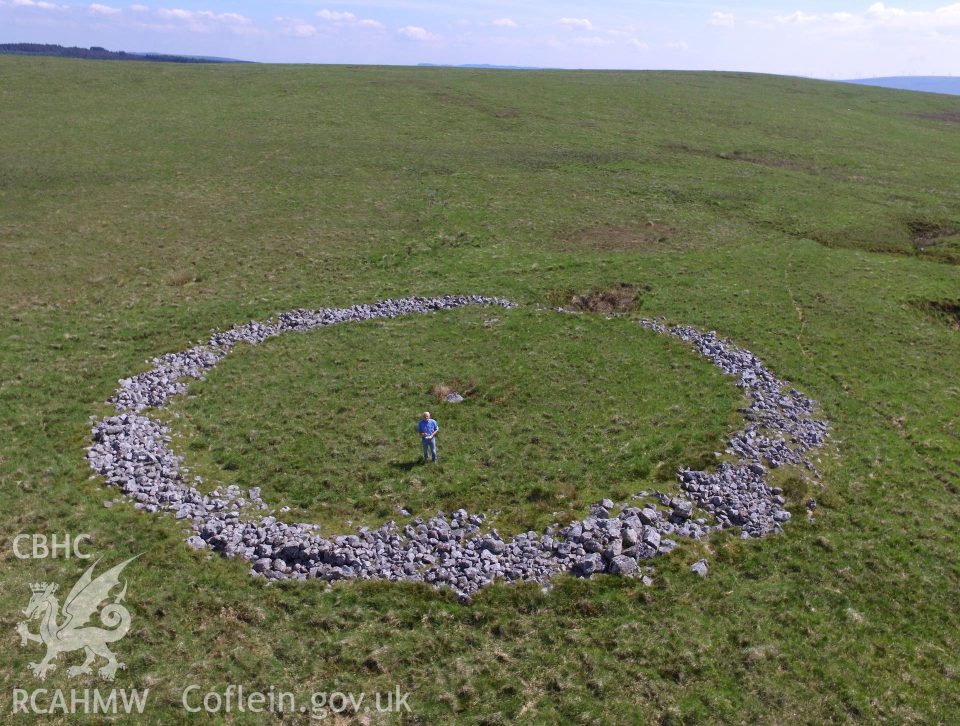 Aerial view of Cefn Sychbant ring cairn, Hirwaun, near Merthyr Tydfil. Colour photograph taken by Paul R. Davis on 10th June 2018.