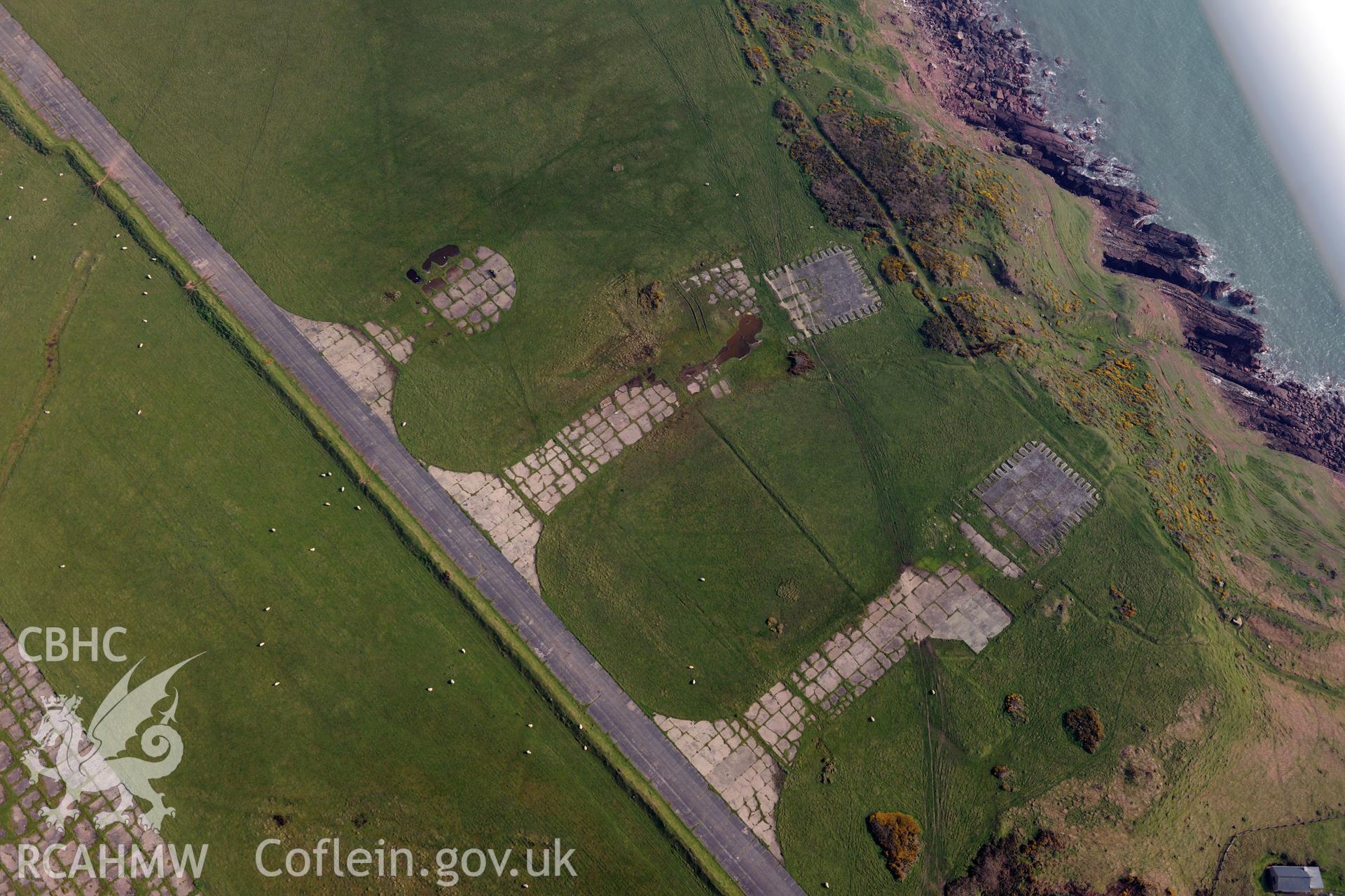 Aerial photography of southern hardstandings at Dale Airfield at SN 795 062 taken on 27th March 2017. Baseline aerial reconnaissance survey for the CHERISH Project. ? Crown: CHERISH PROJECT 2017. Produced with EU funds through the Ireland Wales Co-operation Programme 2014-2020. All material made freely available through the Open Government Licence.