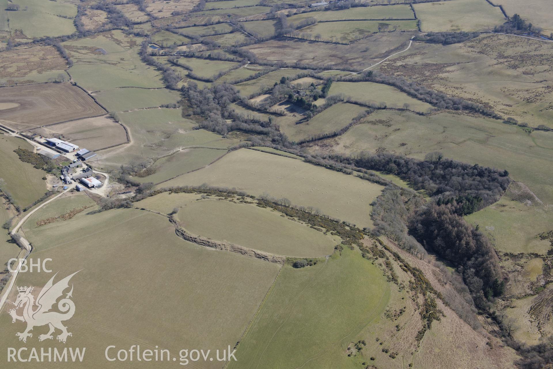 Castell Moeddyn defended enclosure or hillfort north of Gorsgoch, near Lampeter. Oblique aerial photograph taken during the Royal Commission's programme of archaeological aerial reconnaissance by Toby Driver on 2nd April 2013.