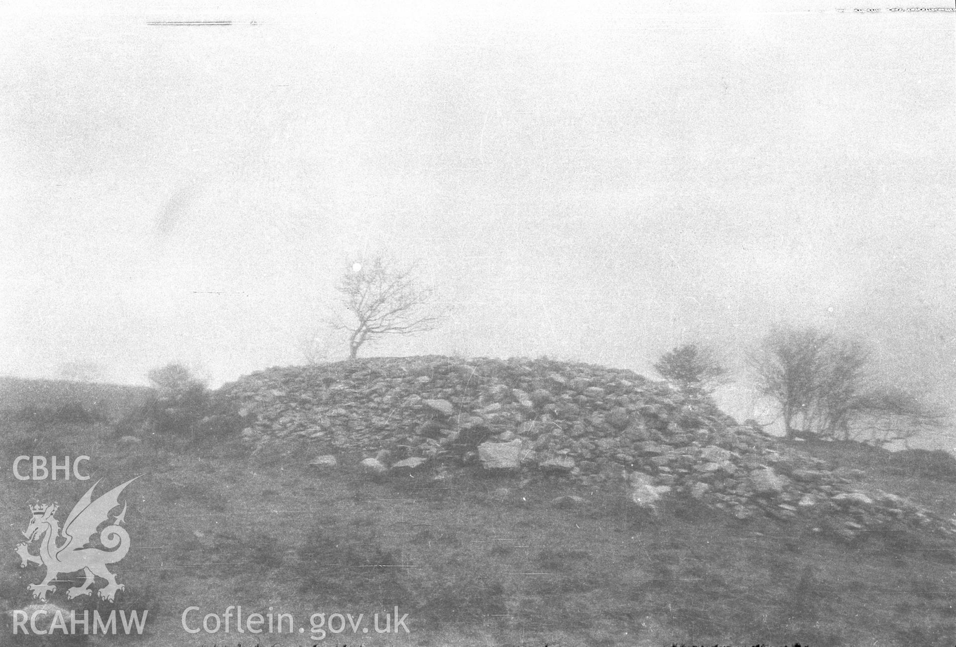 Digital copy of a nitrate negative showing Bryn Owen Farm cairns, Llanbradach. From the Cadw Monuments in Care Collection.