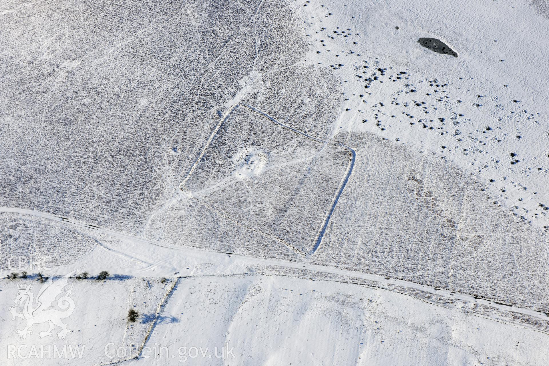 Cwm Blaen Erw enclosure 1 and Cwm Blaen Erw enclosed long hut, Glascwm, north east of Builth Wells. Oblique aerial photograph taken during the Royal Commission?s programme of archaeological aerial reconnaissance by Toby Driver on 15th January 2013.