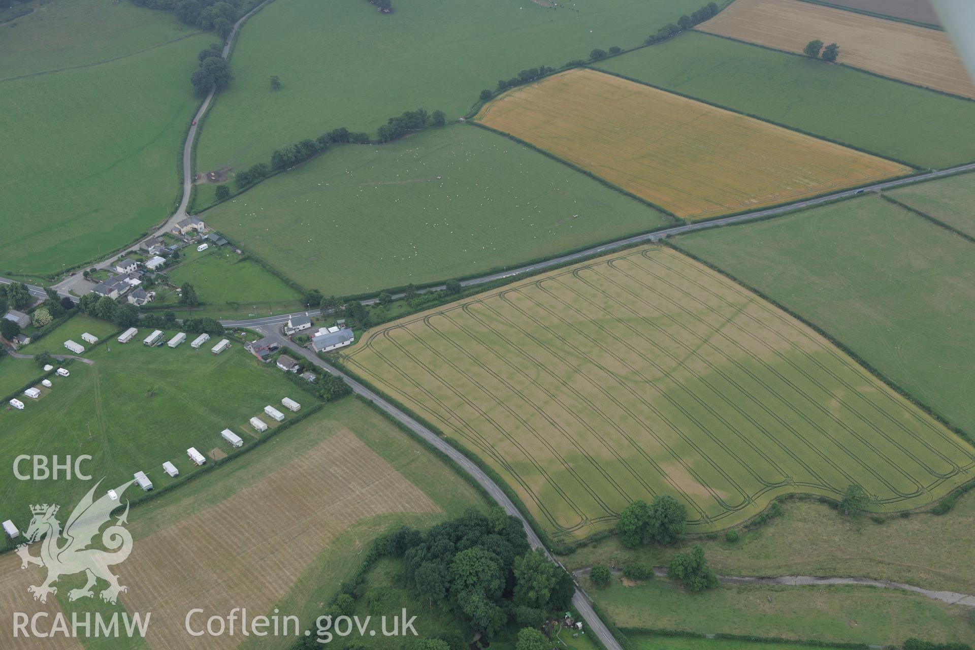 Walton palisaded enclosure and Roman camp, east of Llandrindod Wells, near the Wales-England border. Oblique aerial photograph taken during the Royal Commission?s programme of archaeological aerial reconnaissance by Toby Driver on 1st August 2013.