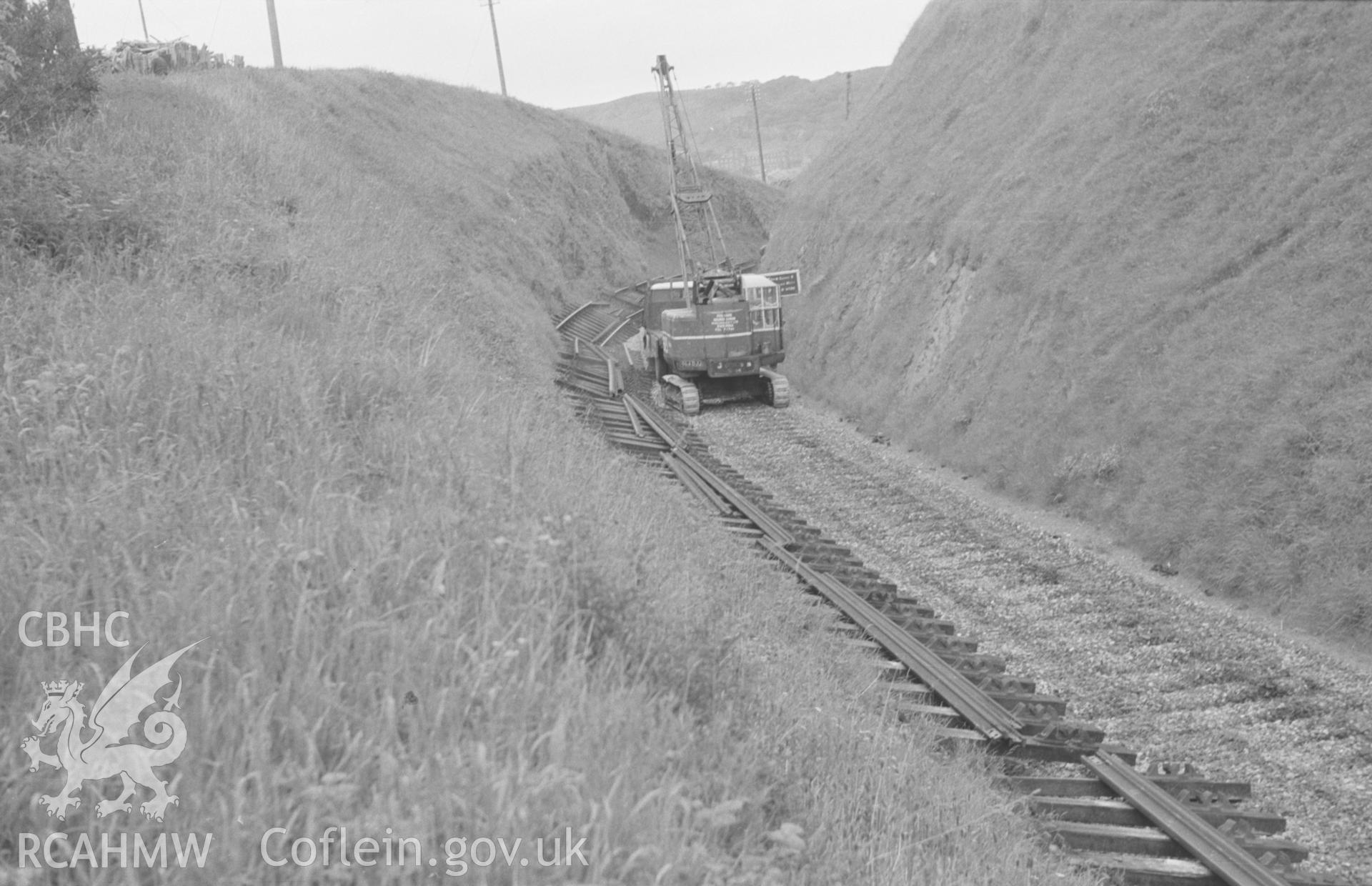 Digital copy of a black and white negative showing the dismantling of the railway at Tanybwlch, near Aberystwyth. Photographed by Arthur O. Chater in June 1966.