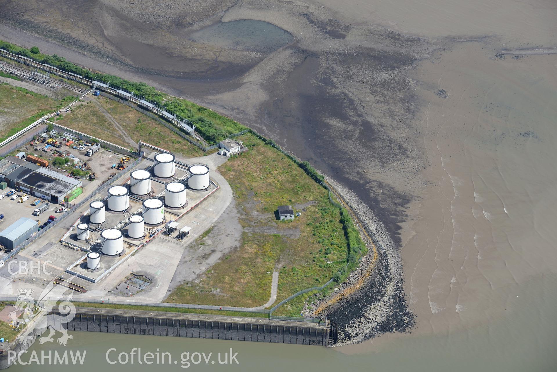 Oil Terminal and Gun Emplacement at Queen Alexandra Dock, Bute Town, Cardiff. Oblique aerial photograph taken during the Royal Commission's programme of archaeological aerial reconnaissance by Toby Driver on 29th June 2015.