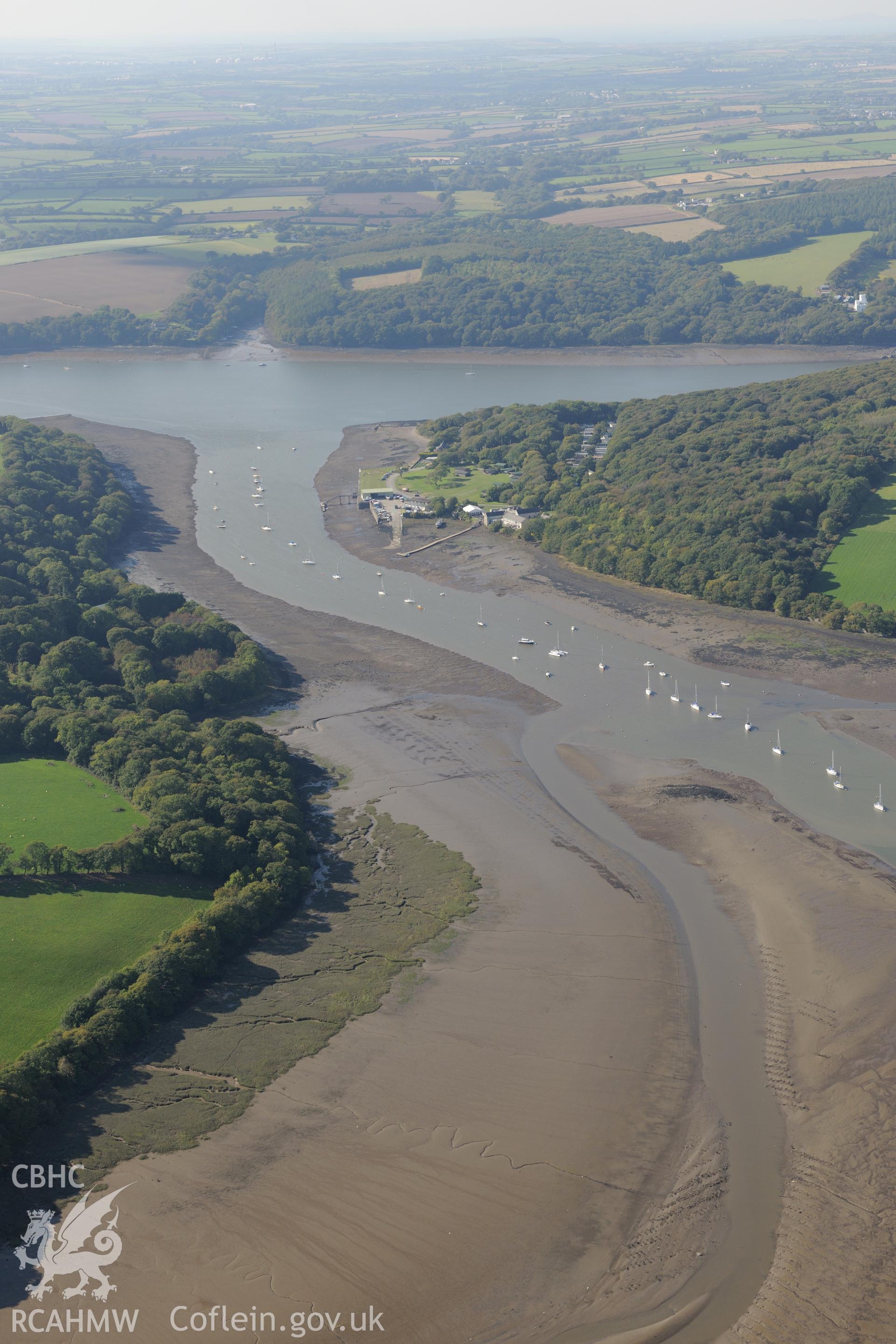 The village of Lawrenny and its quay, on the banks of the Daugleddau river, north east of Pembroke dock. Oblique aerial photograph taken during the Royal Commission?s programme of archaeological aerial reconnaissance by Toby Driver on 30th September 2015.