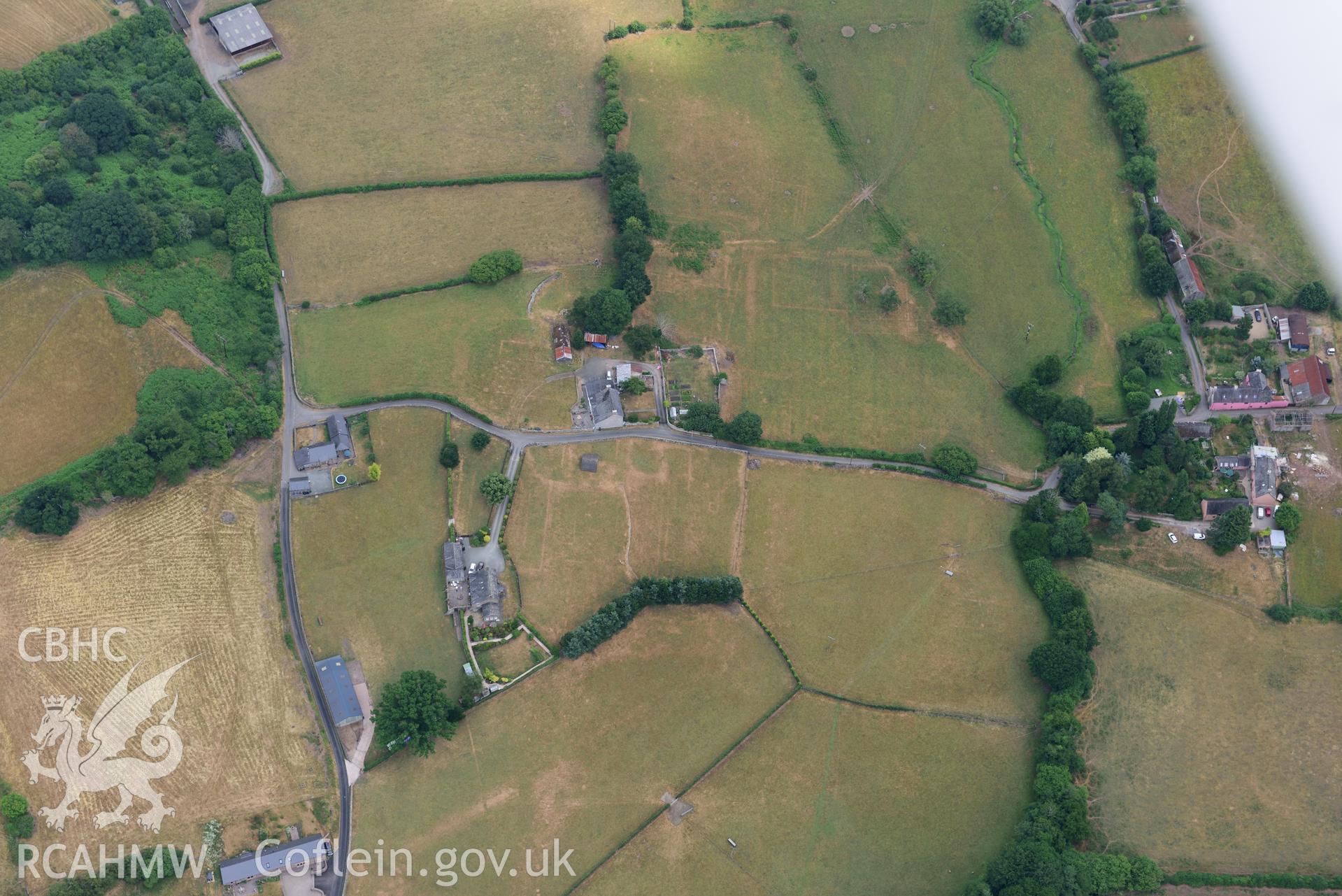 Royal Commission aerial photography of extensive parchmarks at Pen y Gaer Roman fort, including the internal plan and extramural buildings, taken on 19th July 2018 during the 2018 drought.