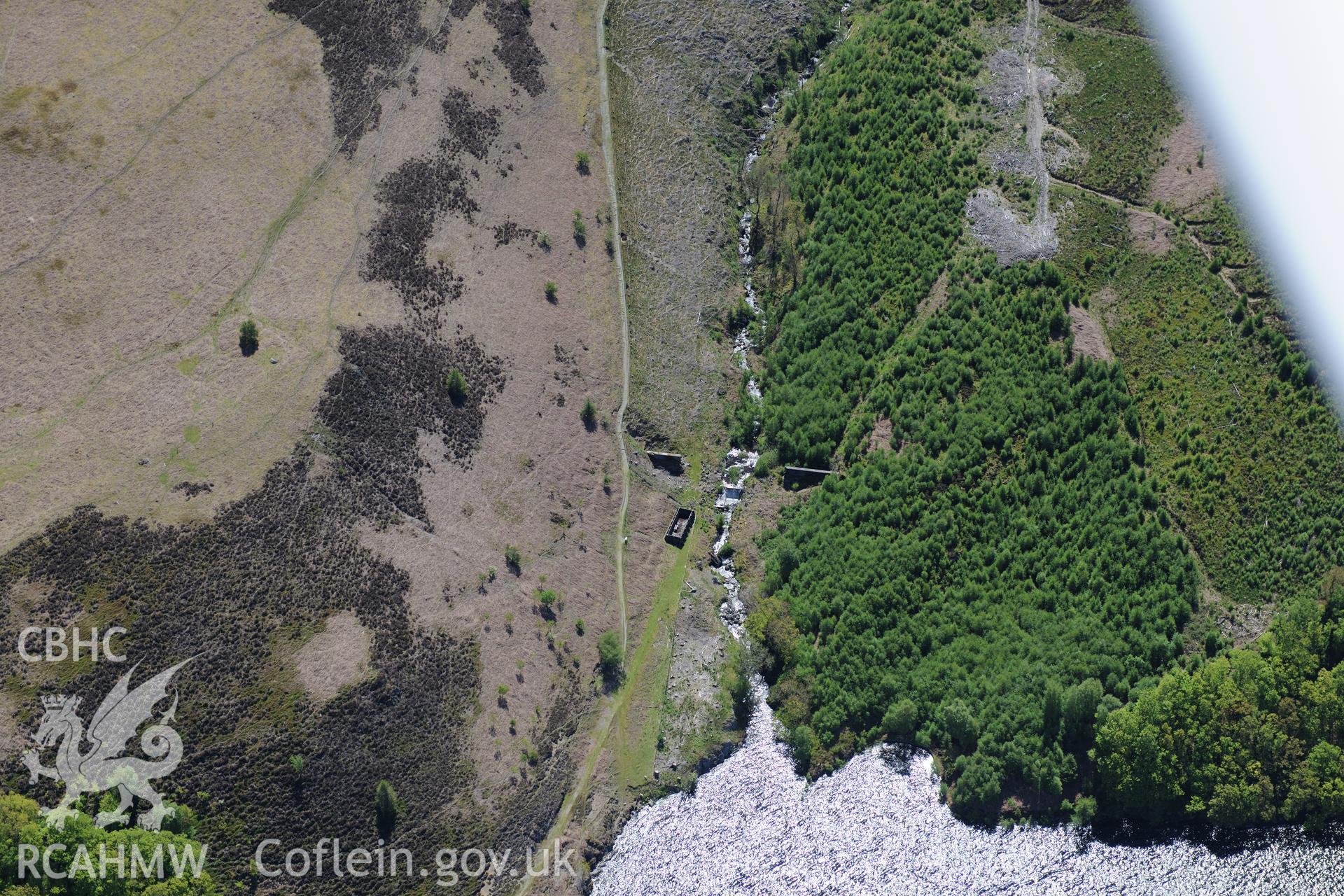 Nant-y-Gro Dam -'Dambusters' testing dam at Elan Valley water scheme. Oblique aerial photograph taken during the Royal Commission's programme of archaeological aerial reconnaissance by Toby Driver on 3rd June 2015.