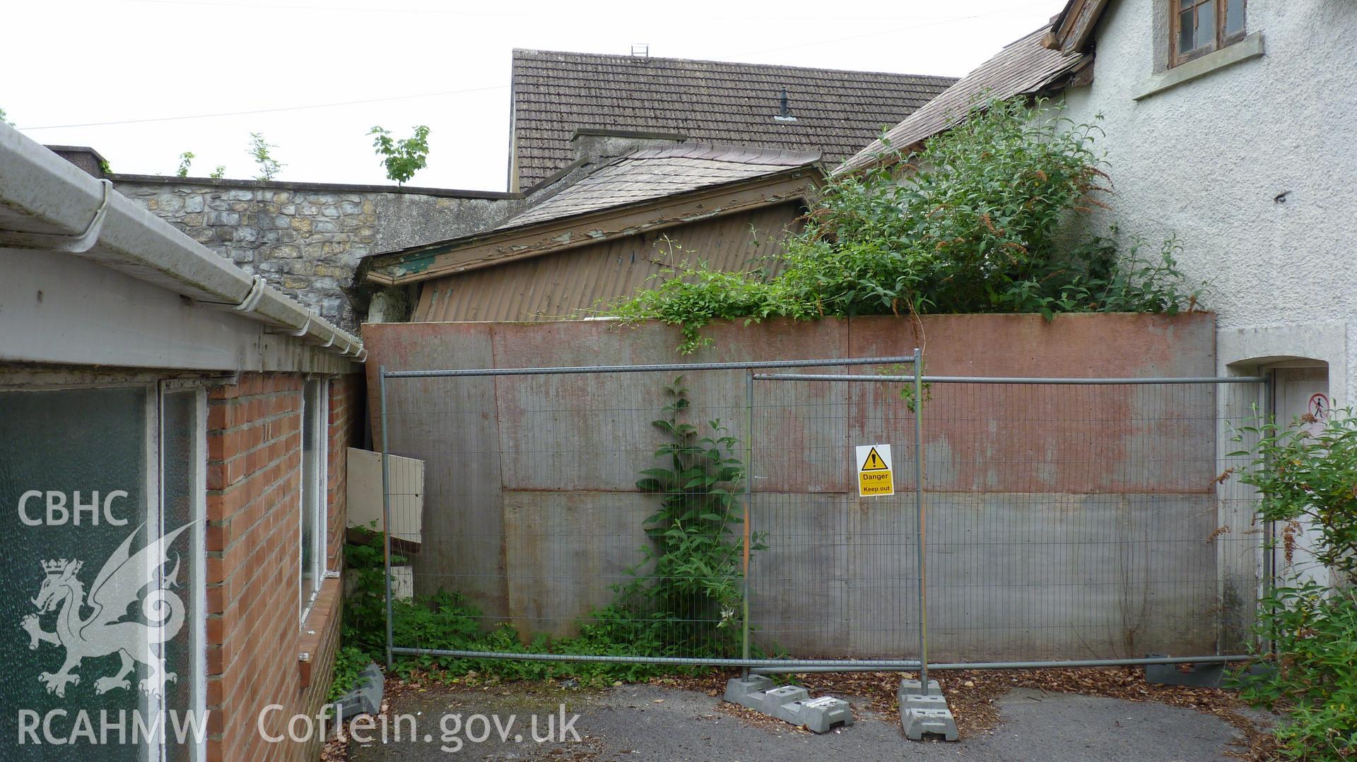 'View west of collapsing structure adjoining the coach house.' Photographed as part of archaeological work at Coed Parc, Newcastle, Bridgend, carried out by Archaeology Wales, 2016. Project no. P2432.