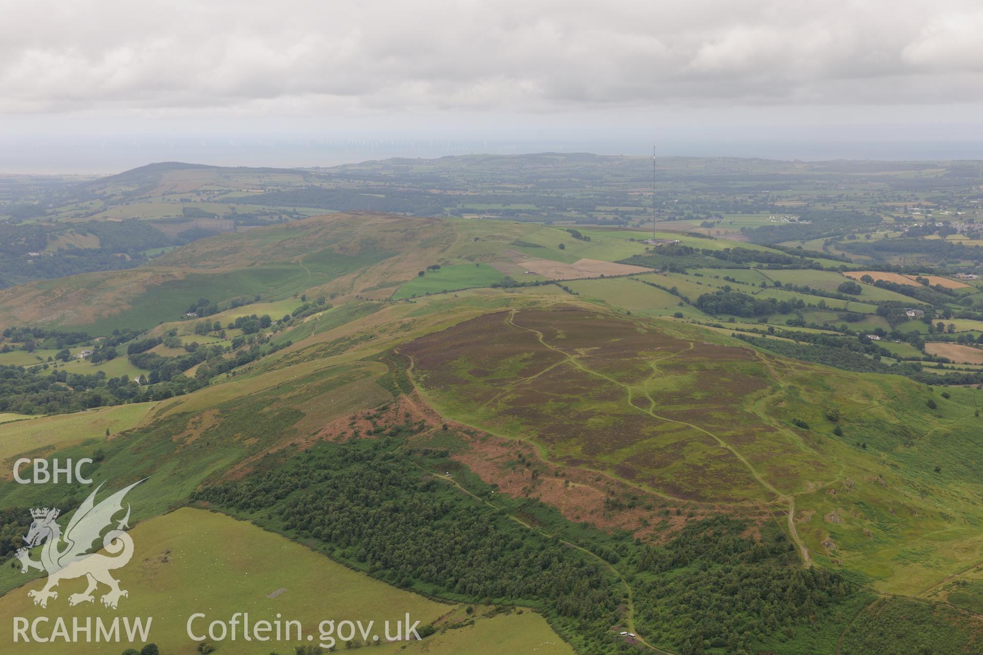 Penycloddiau Hilfort and Hut Platform V, Llangwyfan. Excavation by Liverpool University. Oblique aerial photograph taken during the Royal Commission's programme of archaeological aerial reconnaissance by Toby Driver on 30th July 2015.