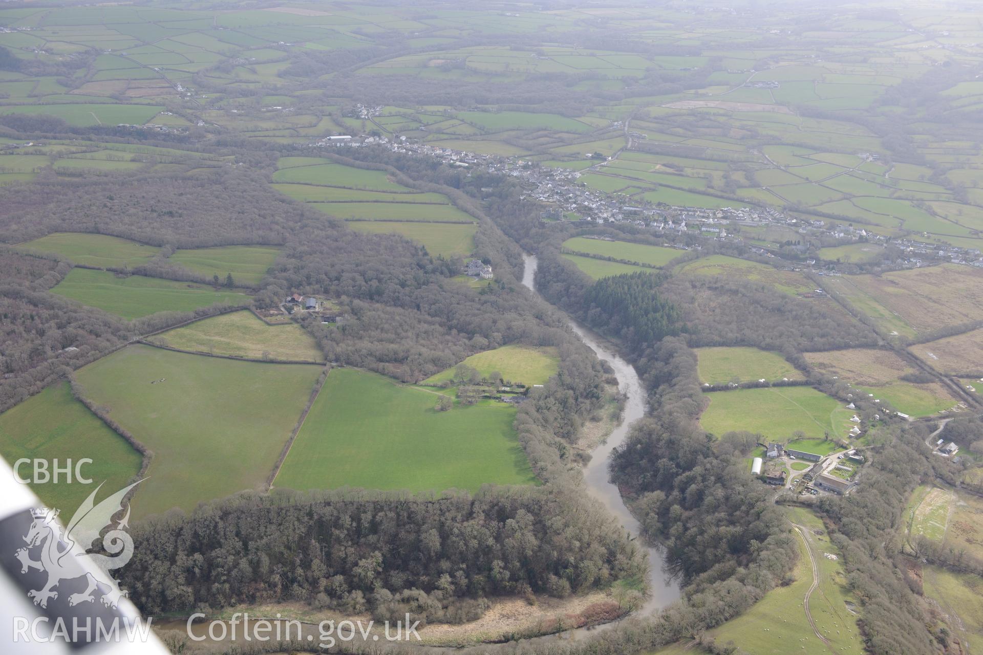 The Teifi river, Coedmore Castle, Coedmore Garden, Cilgerran Home Farm and the village of Cilgerran beyond. Oblique aerial photograph taken during the Royal Commission's programme of archaeological aerial reconnaissance by Toby Driver on 13th March 2015.