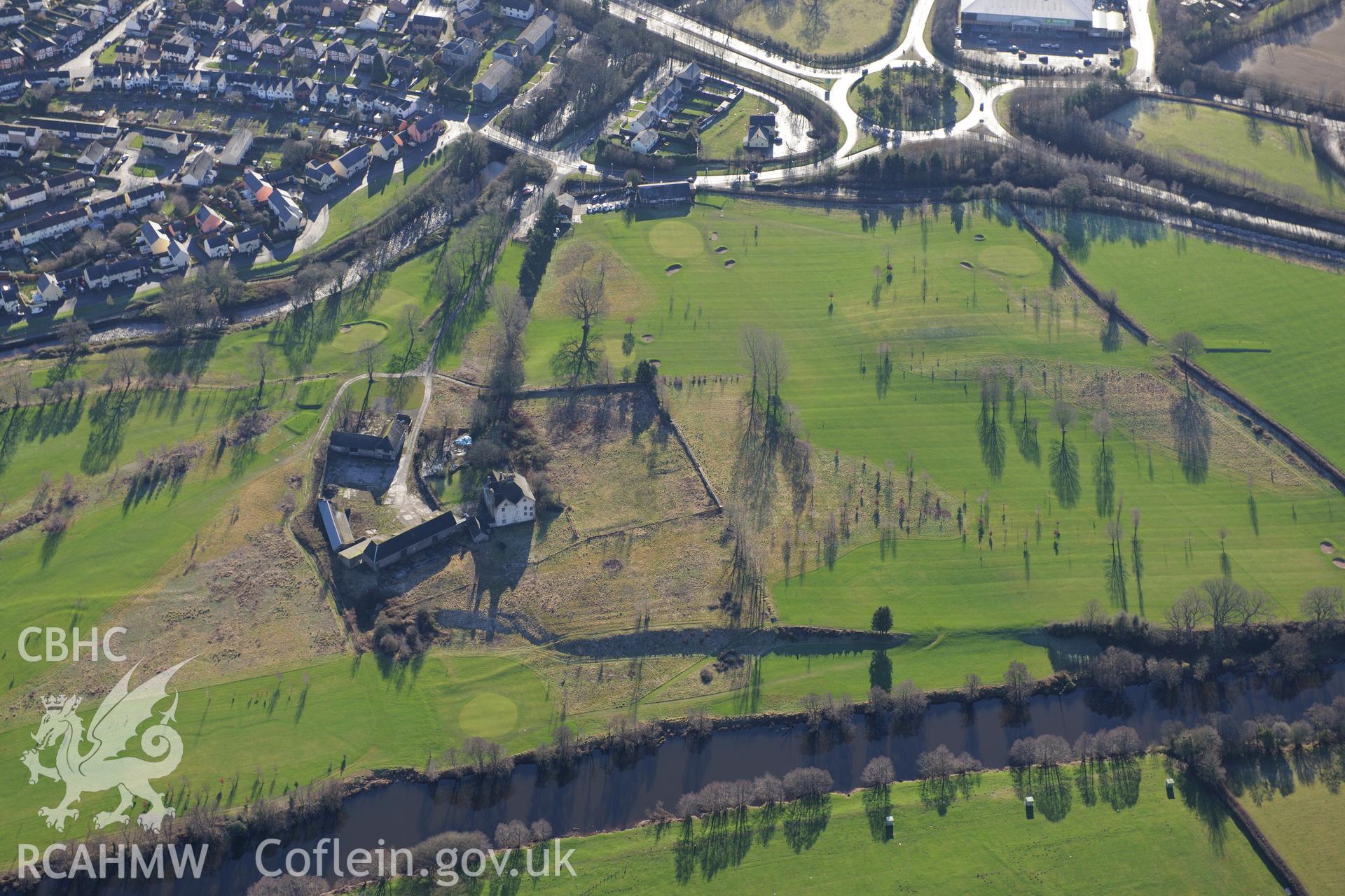 Newtown Farm with associated house, outbuildings and garden features, and the town of Brecon beyond. Oblique aerial photograph taken during the Royal Commission?s programme of archaeological aerial reconnaissance by Toby Driver on 15th January 2013.