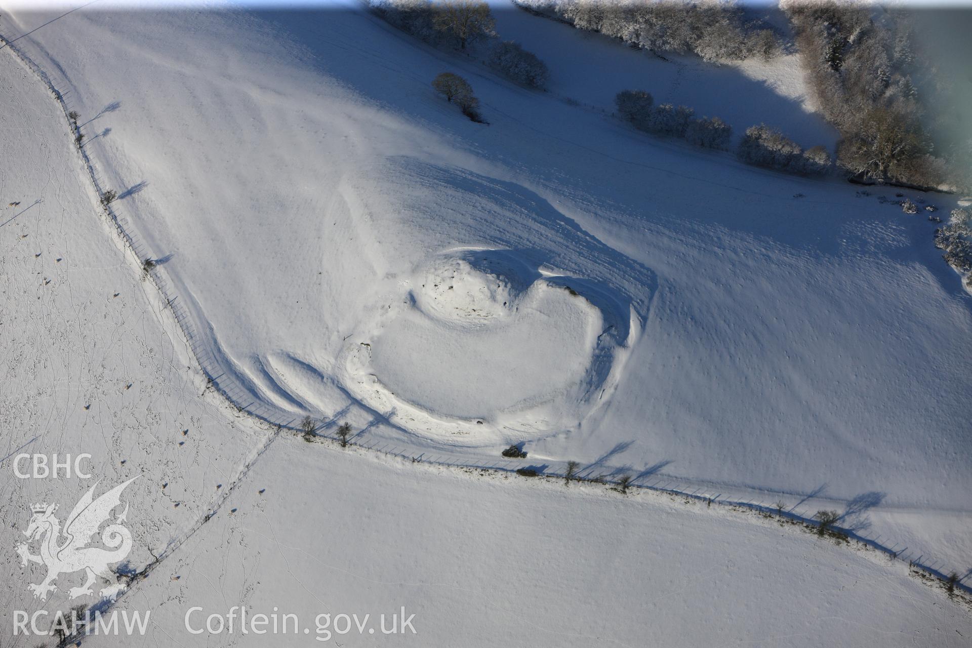 Castell Crugerydd motte and bailey, south east of Llandrindod Wells. Oblique aerial photograph taken during the Royal Commission?s programme of archaeological aerial reconnaissance by Toby Driver on 15th January 2013.