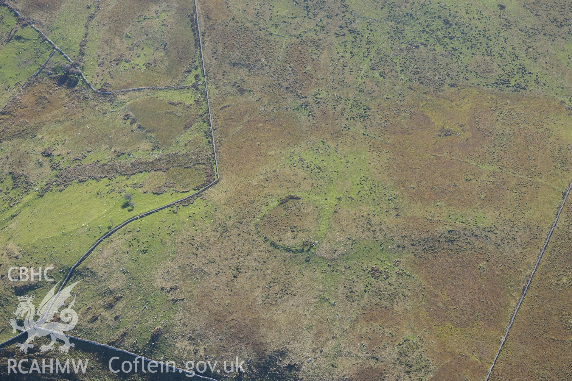 An enclosure at Morfa and hut circles south east of Mynydd Craig Wen, near Fairbourne. Oblique aerial photograph taken during the Royal Commission's programme of archaeological aerial reconnaissance by Toby Driver on 2nd October 2015.