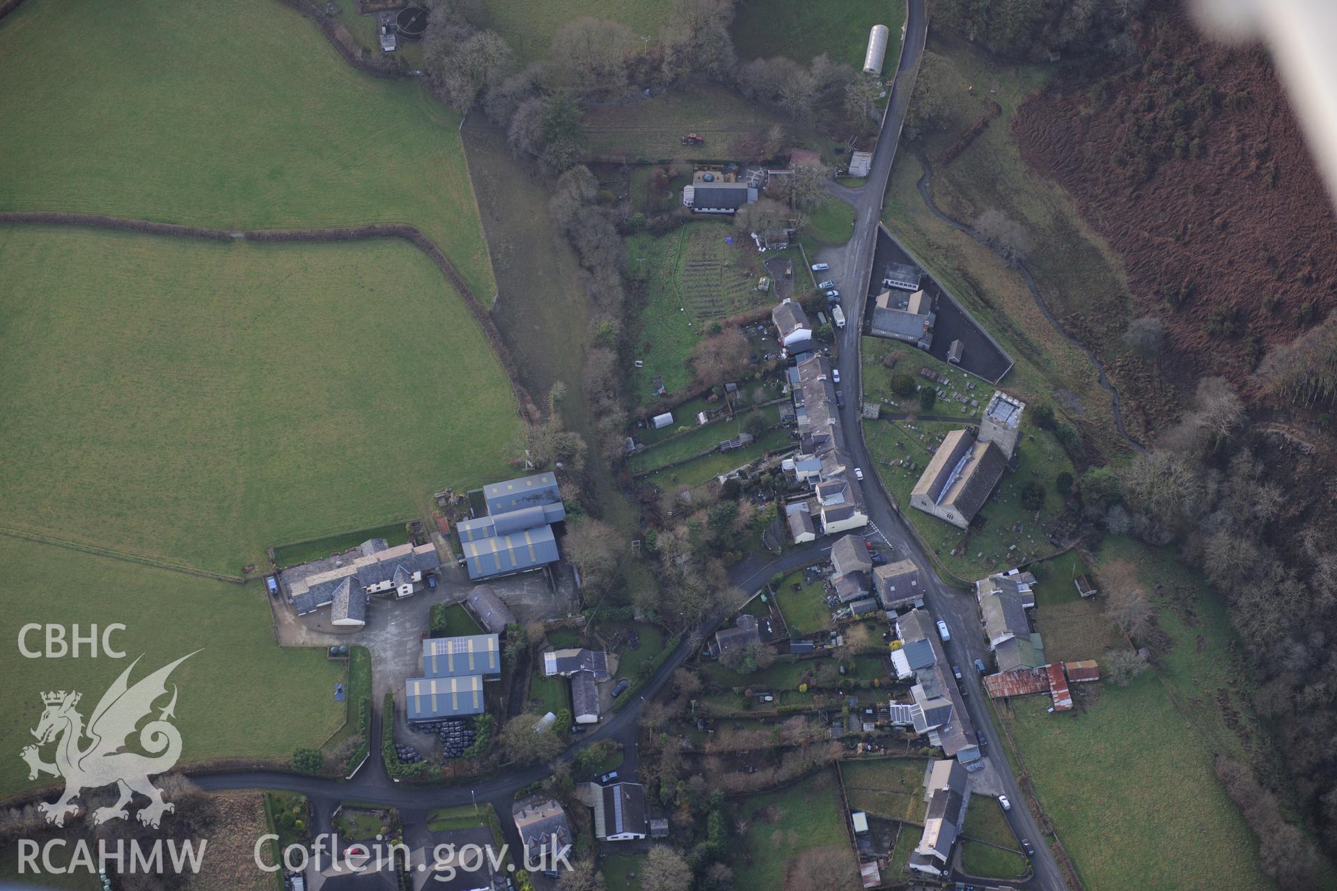 Caio Village and St Cynwyl's Church. Oblique aerial photograph taken during the Royal Commission's programme of archaeological aerial reconnaissance by Toby Driver on 6th January 2015.