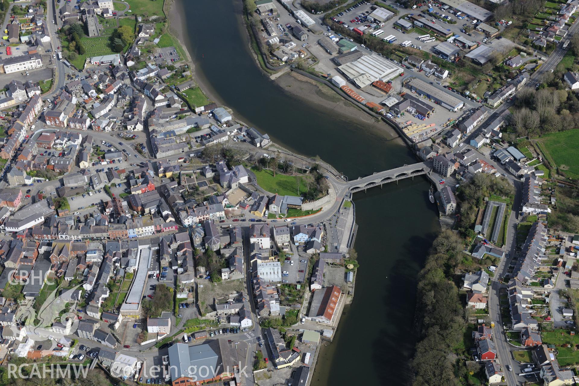 Cardigan Town, Castle, Castle House, Bridge, Harbour and St Mary's Church and Priory. Oblique aerial photograph taken during the Royal Commission's programme of archaeological aerial reconnaissance by Toby Driver 15th April 2015.