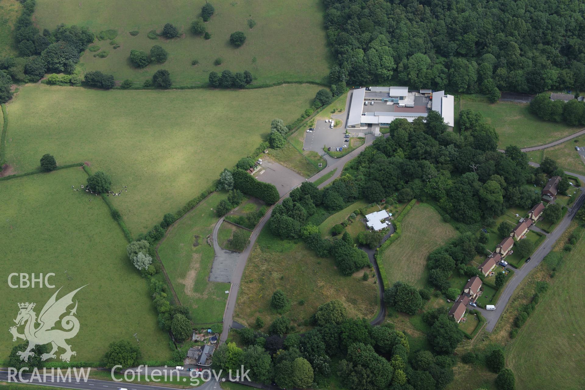 Cwrt-y-Gollen house, garden and army camp, south east of Crickhowell. Oblique aerial photograph taken during Royal Commission?s programme of archaeological aerial reconnaissance by Toby Driver on 1st August 2013.