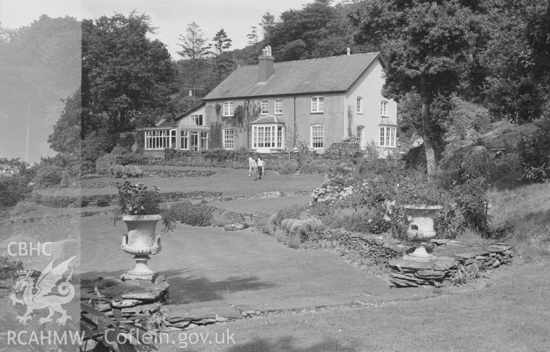 Digital copy of a black and white negative showing Cymerau farmhouse and garden, Eglwysfach, near Machynlleth. Photographed by Arthur O. Chater in August 1965 from Grid Reference SN 6960 9627, looking north east.