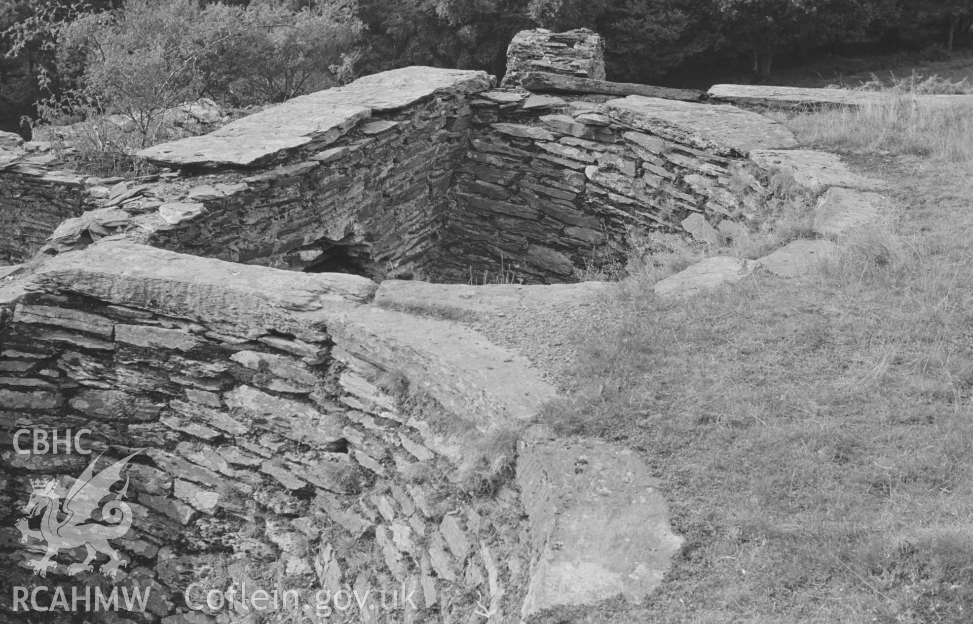 Digital copy of a black and white negative showing the twin funnels at the terminus of the tramway just above the main mine buildings at Bryndyfi Lead Mine, Eglwysfach. Photographed by Arthur O. Chater in August 1966 from Grid Ref SN 683 934, looking west.