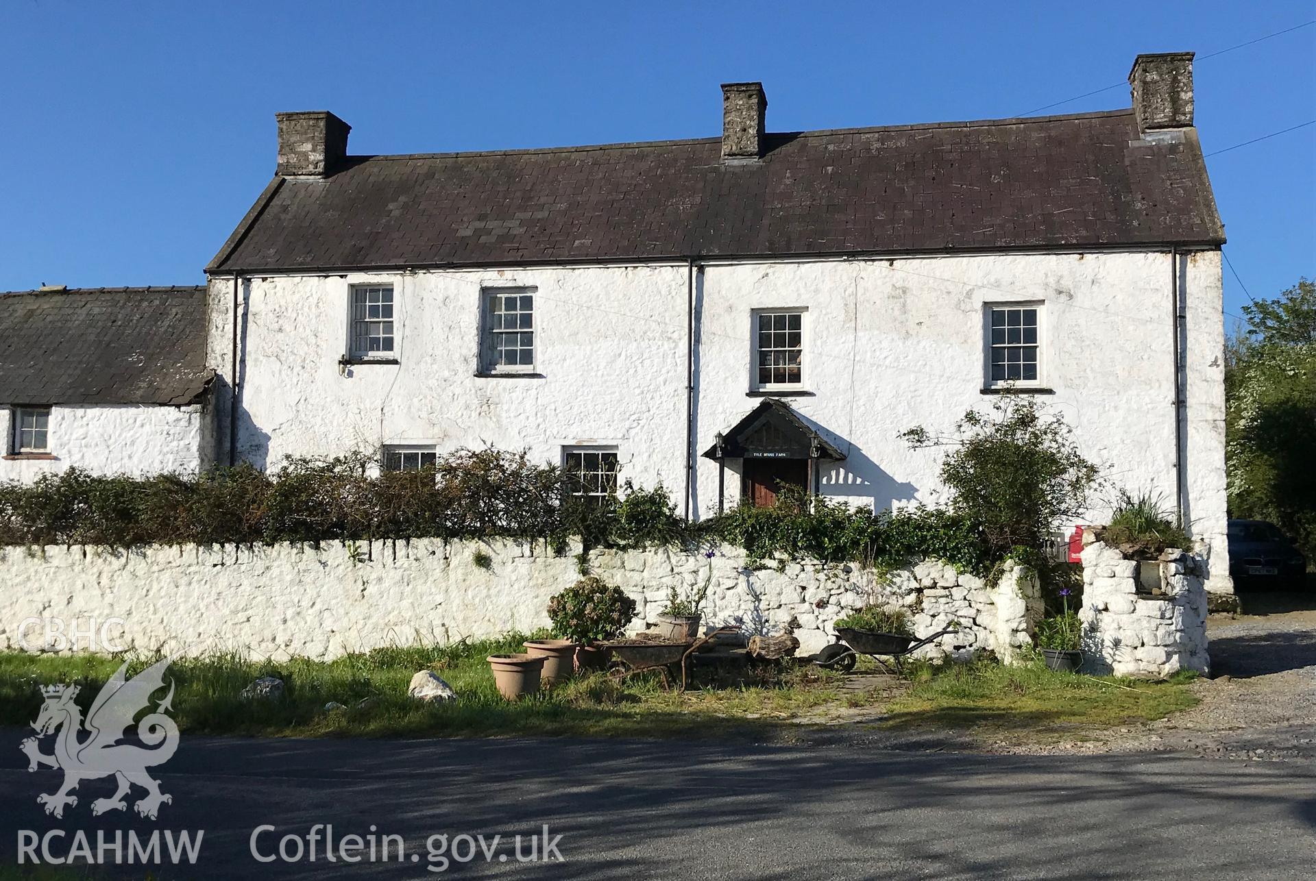 Digital colour photograph showing exterior view of the front elevation of Tyle House Farm, Burry Green, Swansea, taken by Paul R. Davis on 5th May 2019.