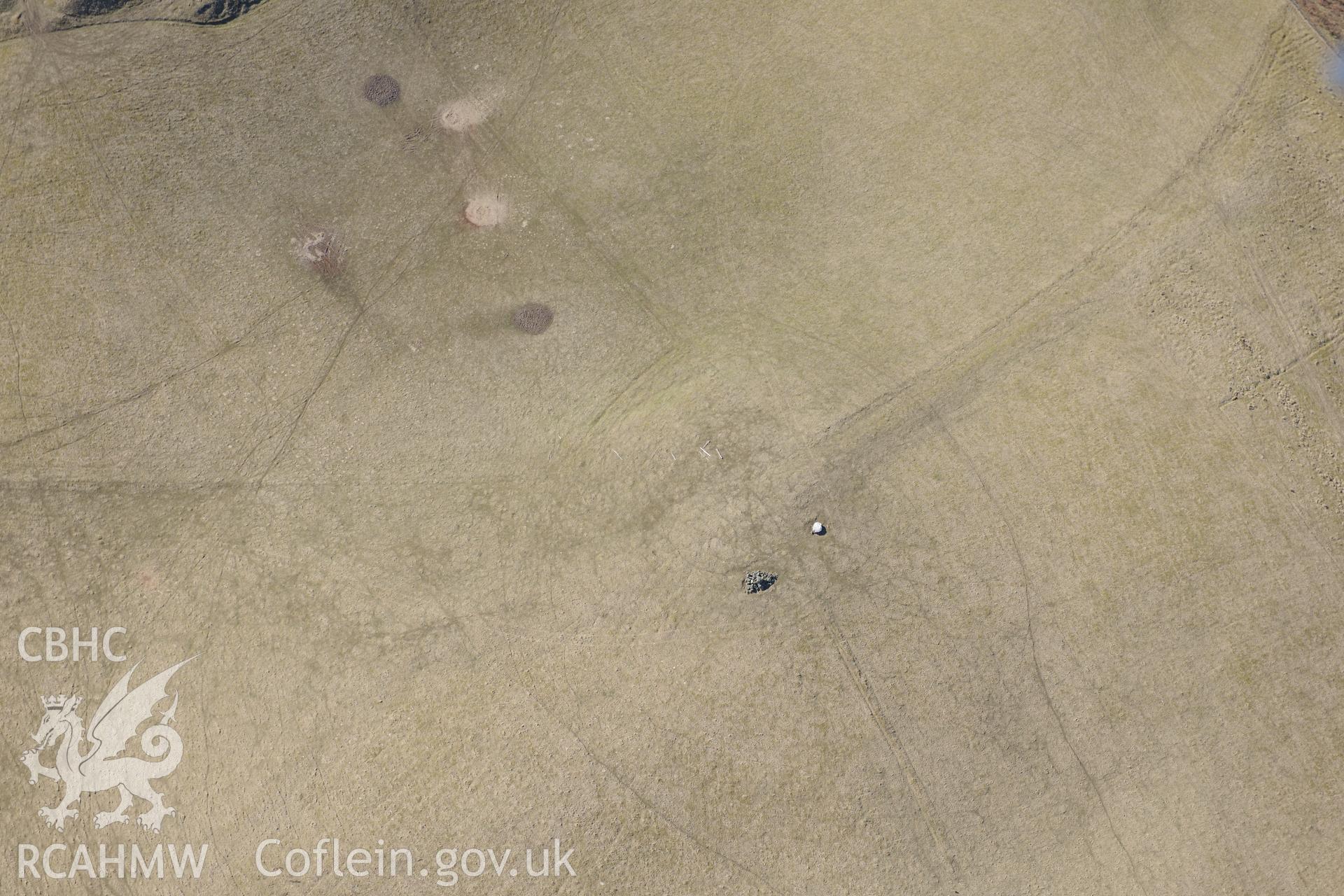 Quarts boulder at Gaer Fawr hillfort, north of Lledrod, Aberystwyth. Oblique aerial photograph taken during the Royal Commission?s programme of archaeological aerial reconnaissance by Toby Driver on 2nd April 2013.