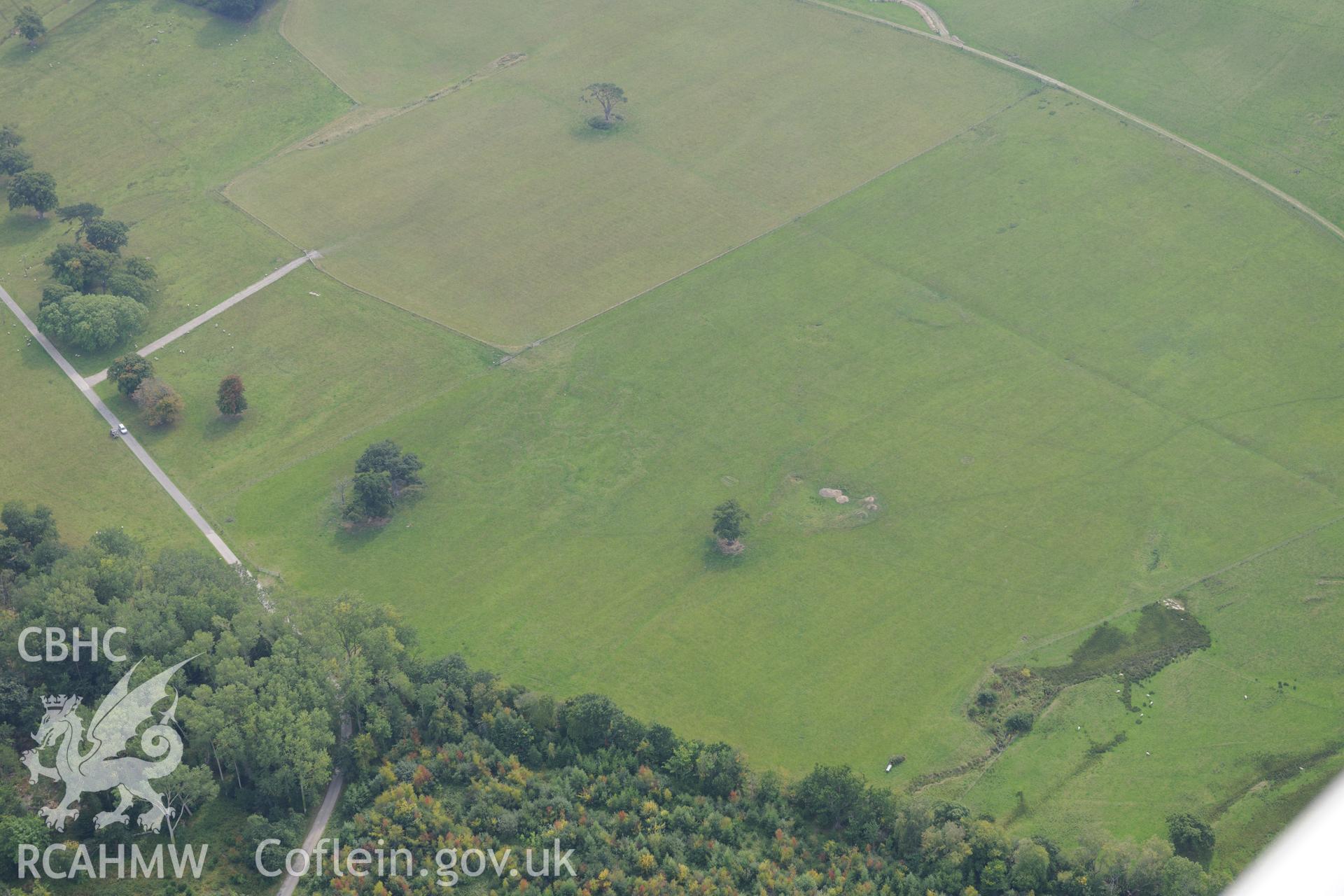 St. George's well and First World War practise trenches at Kinmel Park. Oblique aerial photograph taken during the Royal Commission's programme of archaeological aerial reconnaissance by Toby Driver on 11th September 2015.