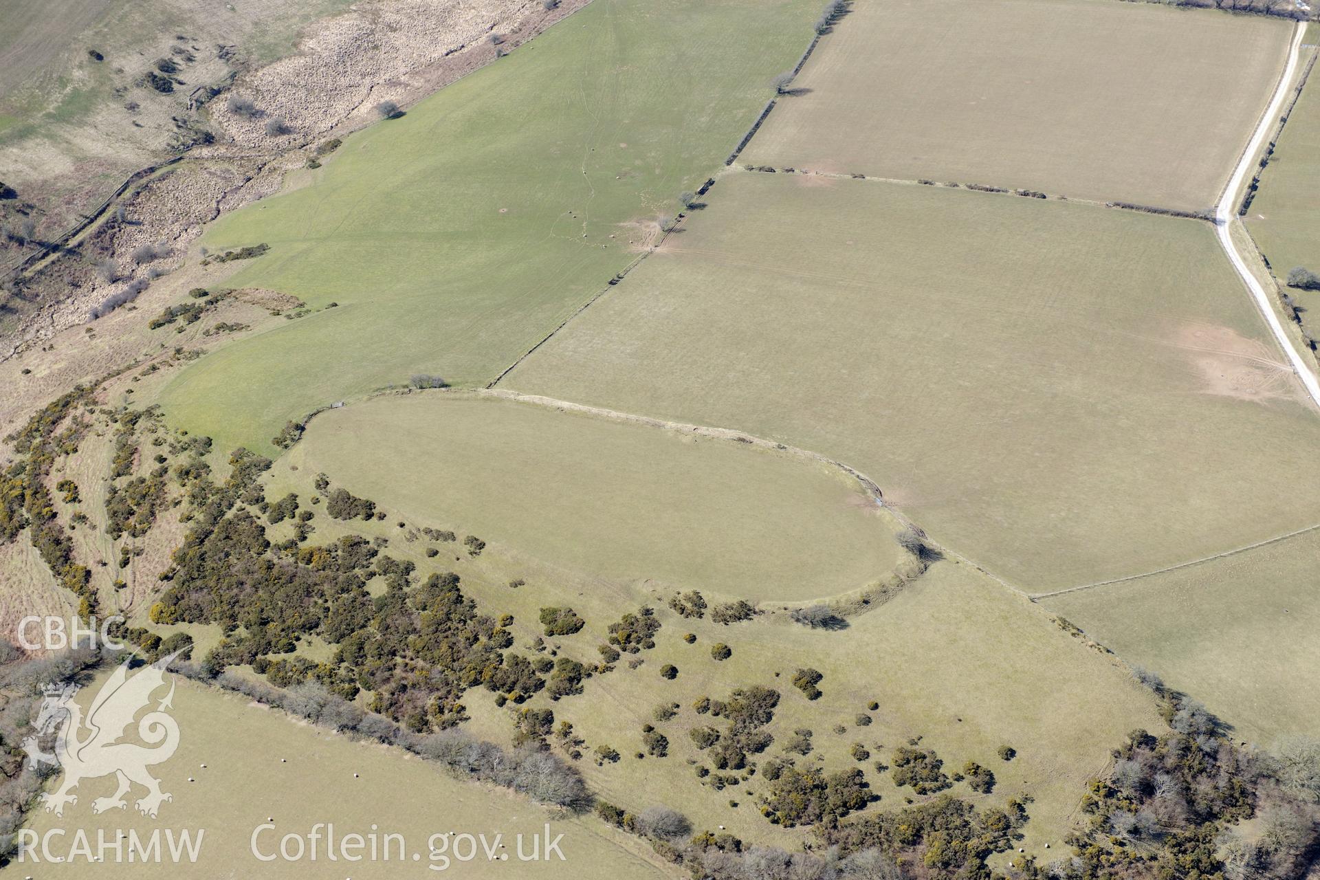 Castell Moeddyn defended enclosure or hillfort north of Gorsgoch, near Lampeter. Oblique aerial photograph taken during the Royal Commission's programme of archaeological aerial reconnaissance by Toby Driver on 2nd April 2013.