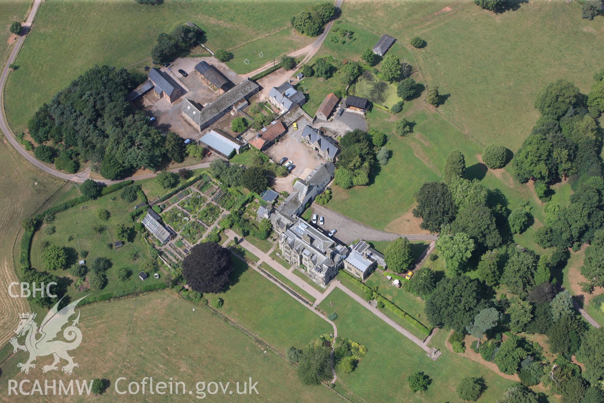 Dingestow Court with its garden and barns, Dingestow, between Monmouth and Raglan. Oblique aerial photograph taken during the Royal Commission?s programme of archaeological aerial reconnaissance by Toby Driver on 1st August 2013.