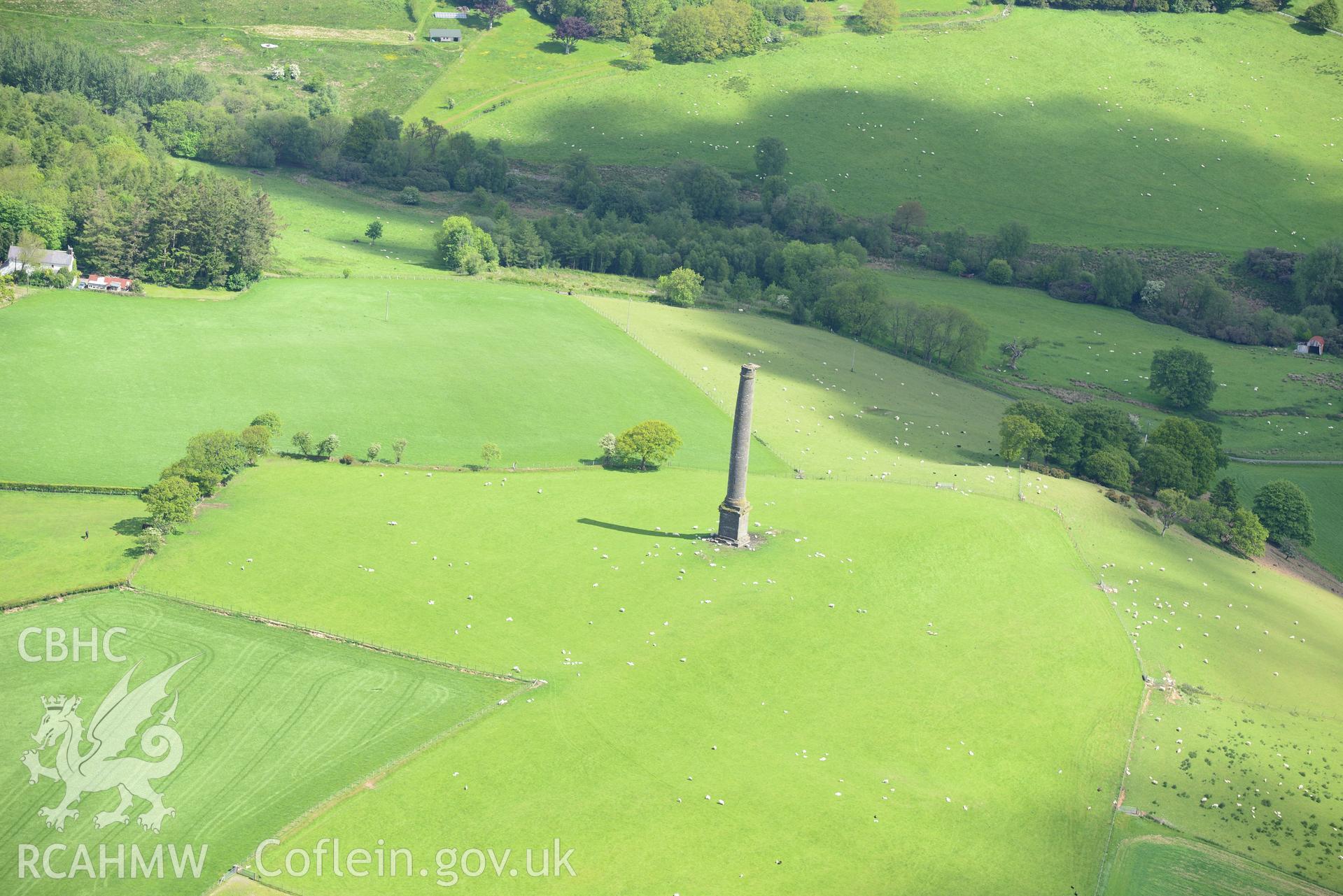 Coed-Parc hillfort and Dery-Ormond Tower. Oblique aerial photograph taken during the Royal Commission's programme of archaeological aerial reconnaissance by Toby Driver on 3rd June 2015.