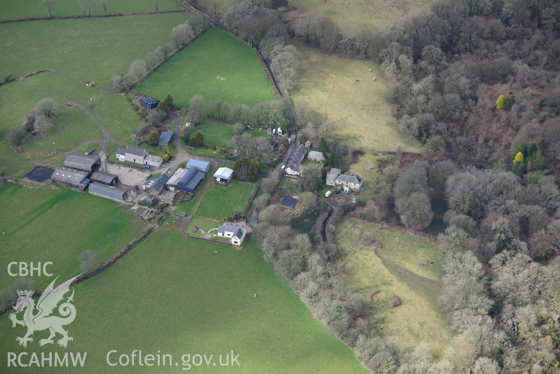 Prysg Farm and two standing stones in its southern fields; Temple Druid house and garden; outbuildings and 1-3 Temple Druid cottages, Maenclochog, Fishguard. Oblique aerial photograph taken during the Royal Commission's programme of archaeological aerial reconnaissance by Toby Driver on 13th March 2015.