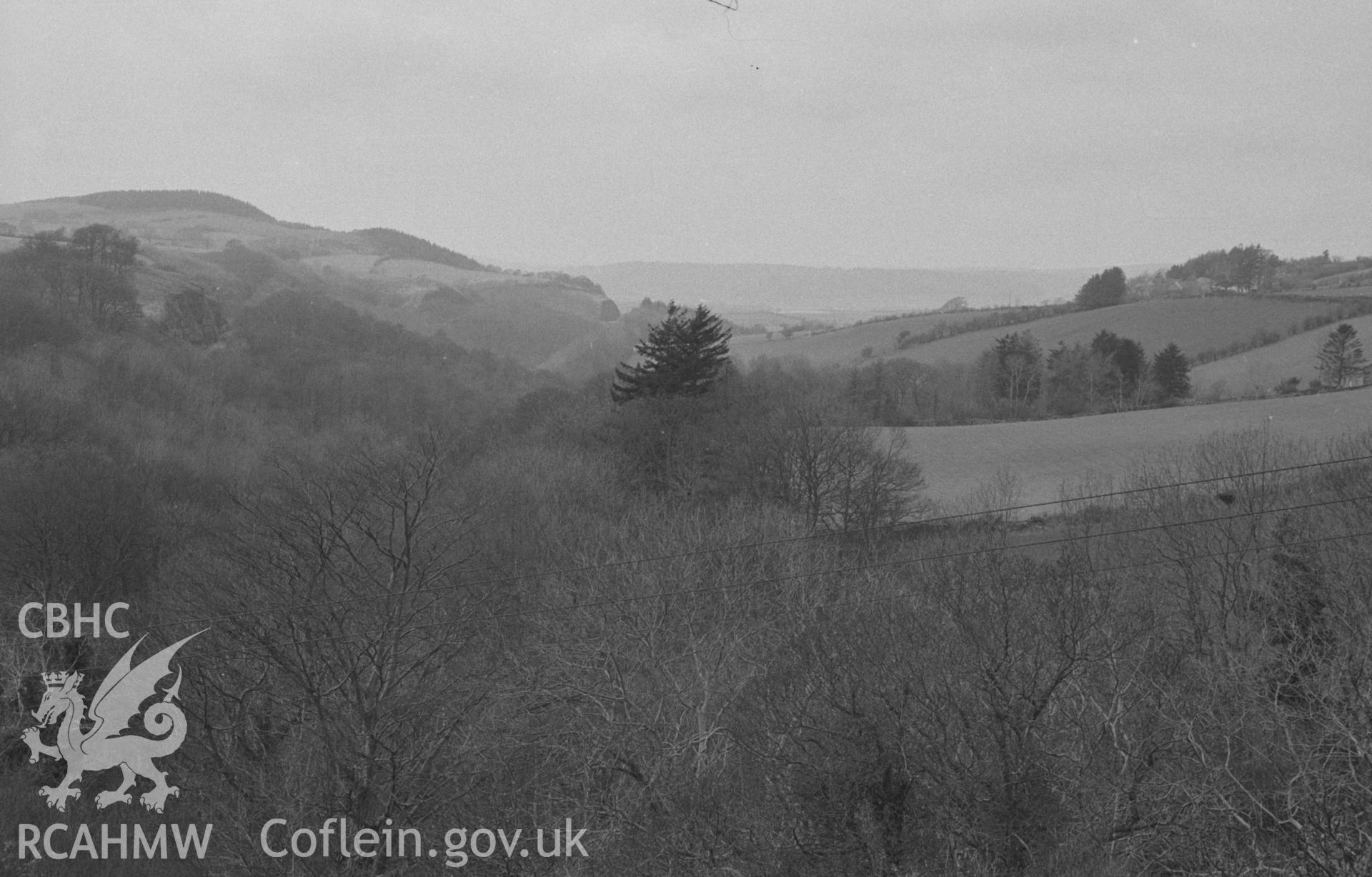 Digital copy of a black & white negative showing view of Coed Berth-Lwyd, looking down the Sychnant from back of Post Office. Caradoc Falls Halt on left. Photographed in April 1964 by Arthur O. Chater from Grid Reference SN 6926 6948, looking north west.