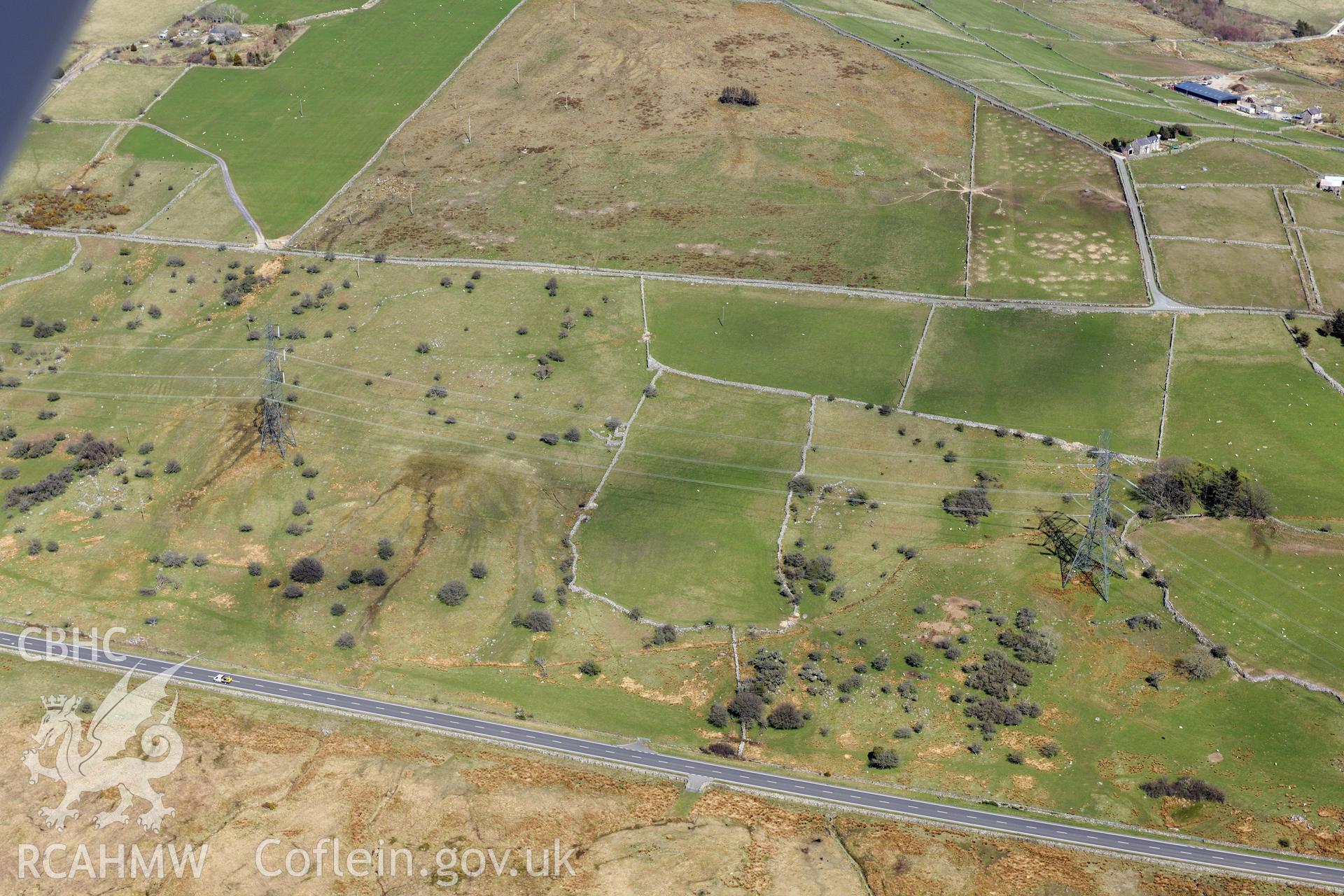 Field system south of Caerau, Llanllyfni, north west of Porthmadog. Oblique aerial photograph taken during the Royal Commission?s programme of archaeological aerial reconnaissance by Toby Driver on 1st May 2013.