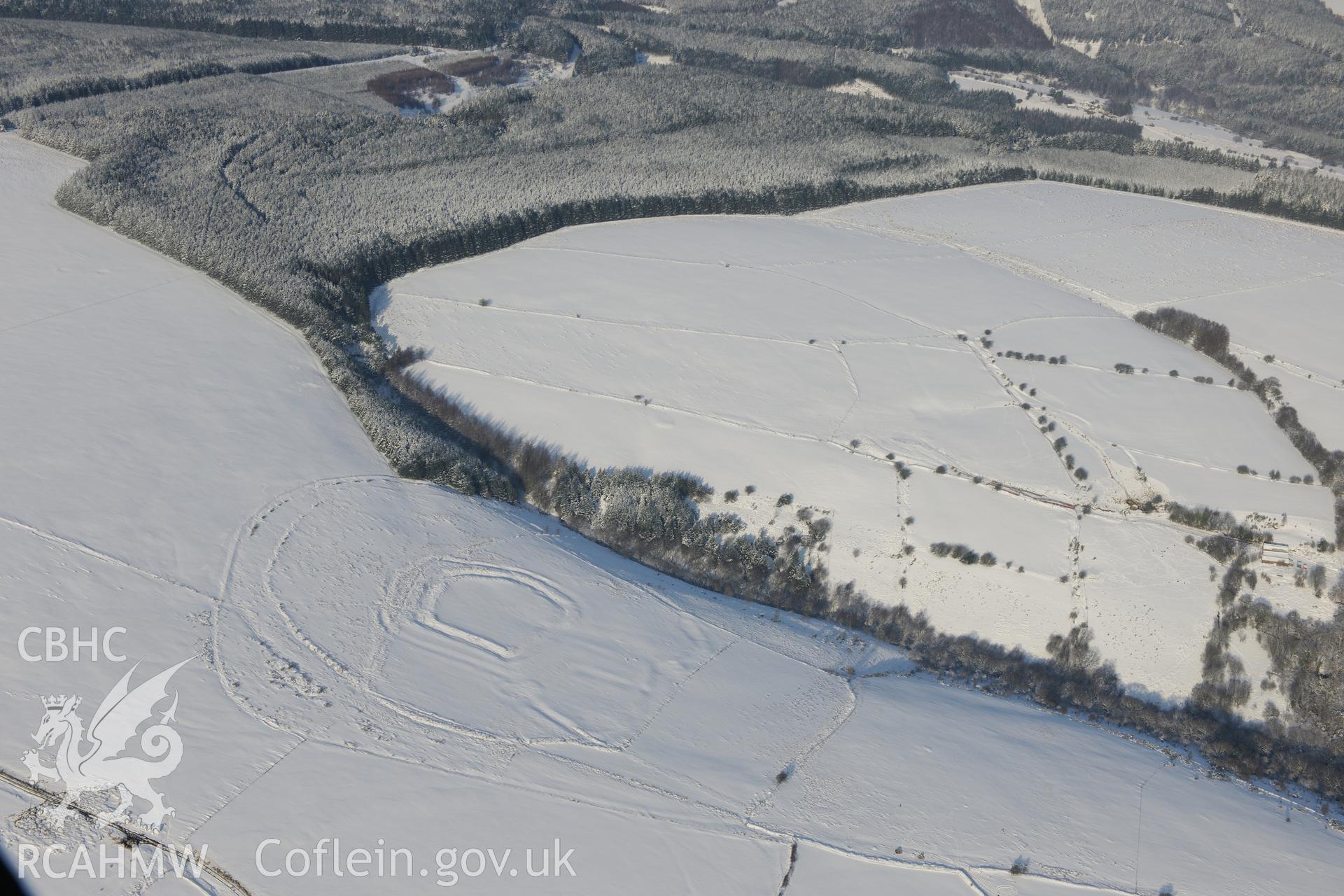 House platform within Y Bwlwarcau hillfort, on the eastern edge of Margam Forest, south of Maesteg. Oblique aerial photograph taken during the Royal Commission?s programme of archaeological aerial reconnaissance by Toby Driver on 24th January 2013.