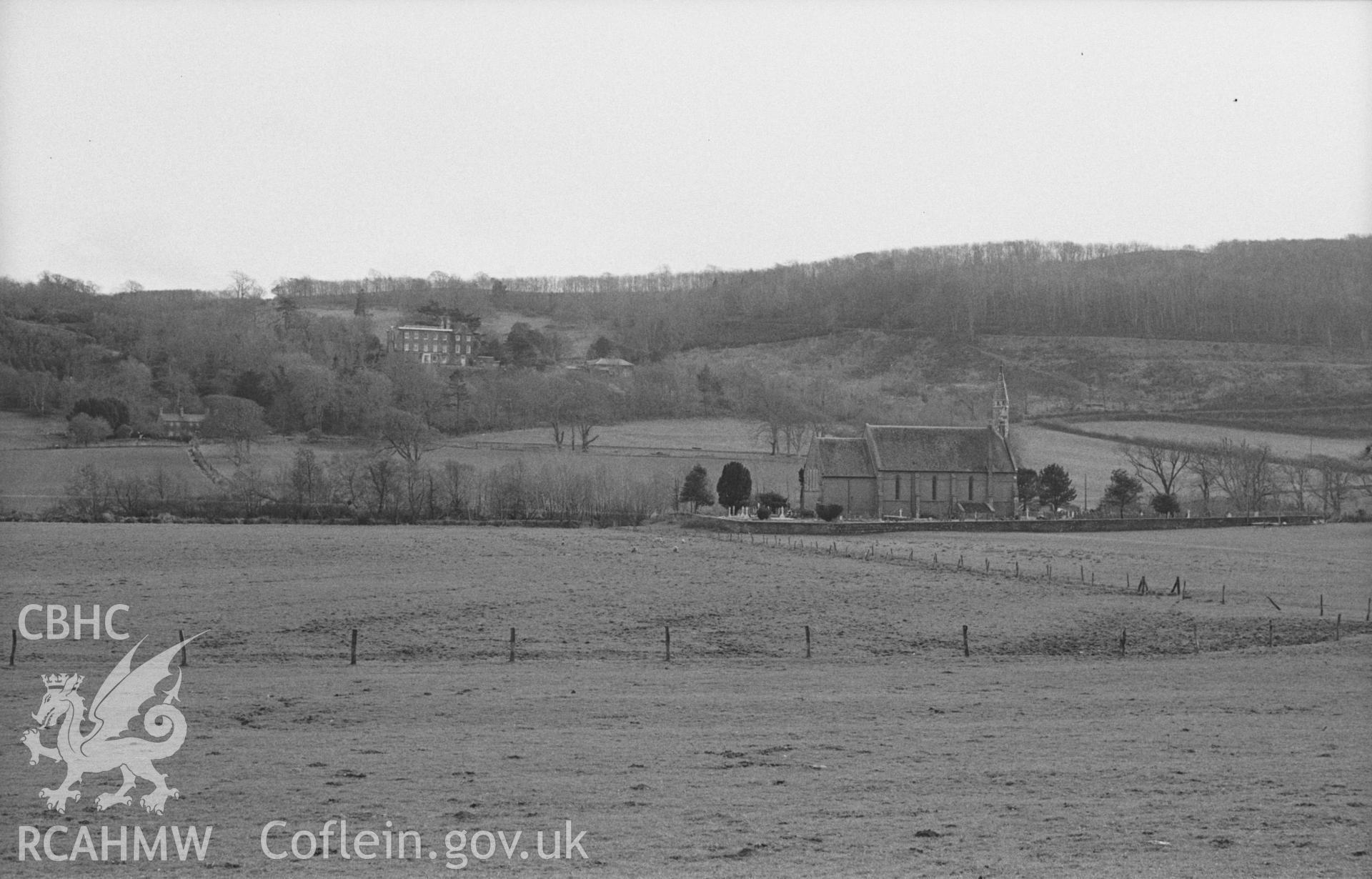 Digital copy of black & white negative showing All Saints Church, Llangorwen, with Plas Cwmcynfelin beyond and Hen-gwm farm on the left. Photographed in April 1963 by Arthur O. Chater from the road at Grid Reference SN 6042 8409, looking south south west.