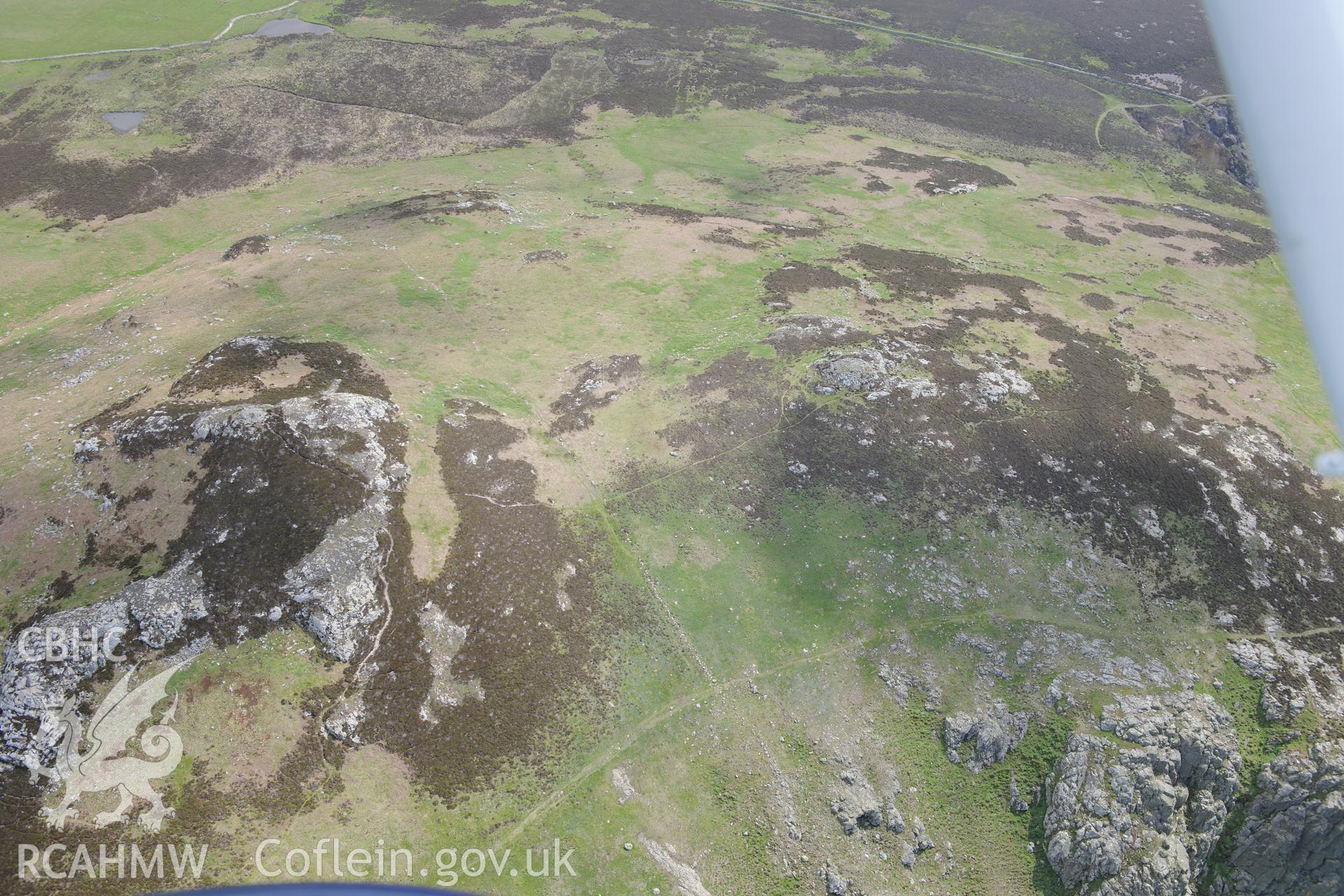 Carn Llundain and its relict field walls on Ramsey Island. Oblique aerial photograph taken during the Royal Commission's programme of archaeological aerial reconnaissance by Toby Driver on 13th May 2015.