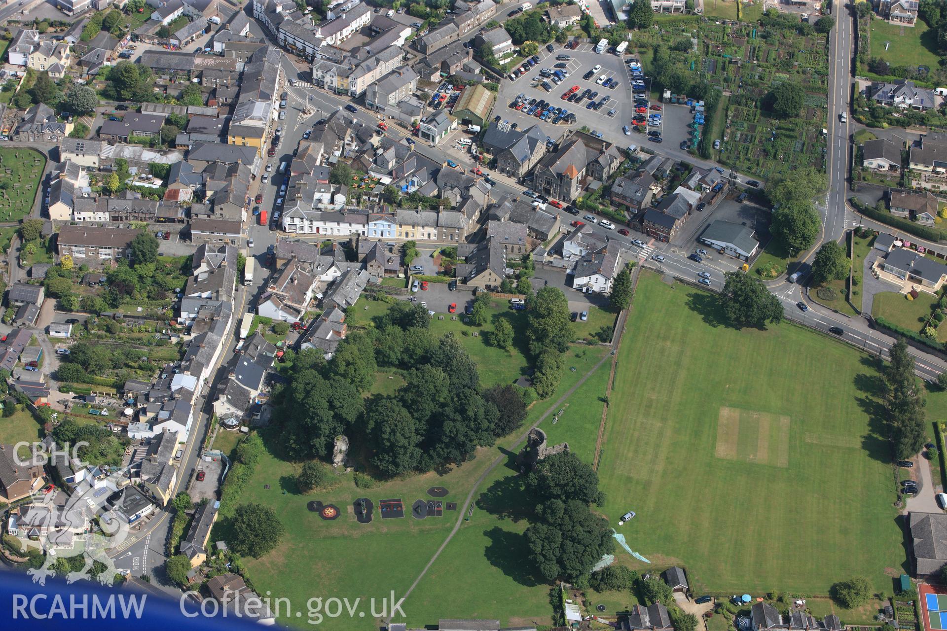 The remains of Alisby's Castle, on the southern edge of Crickhowell. Oblique aerial photograph taken during the Royal Commission?s programme of archaeological aerial reconnaissance by Toby Driver on 1st August 2013.