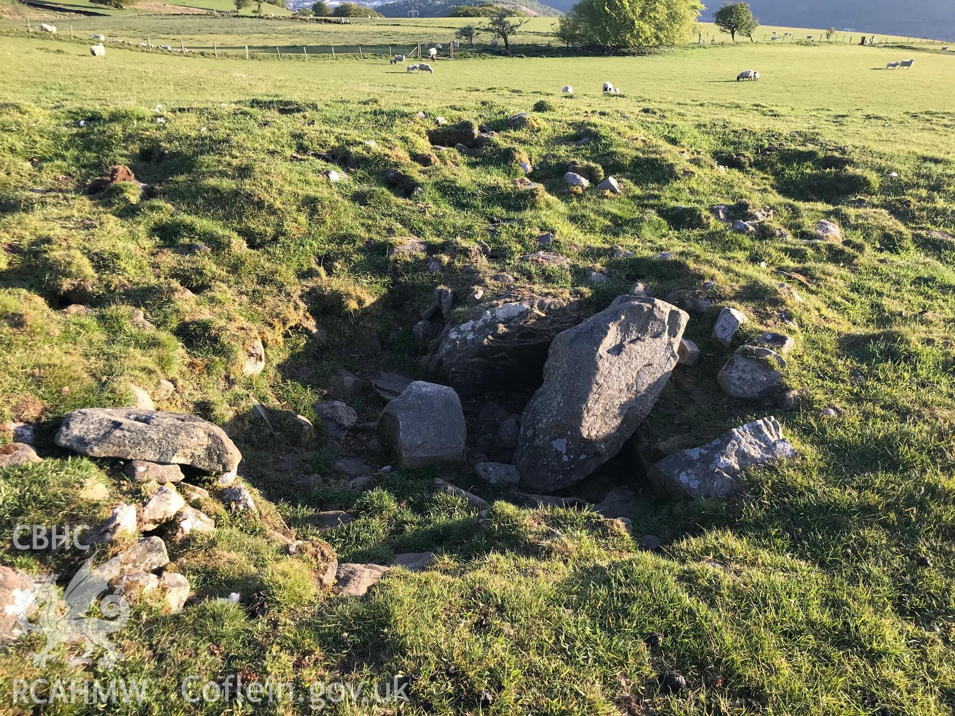 Digital colour photograph showing detailed view of Mynydd Bach cairn or round barrow, Maesycwmmer, taken by Paul R. Davis on 13th May 2019.